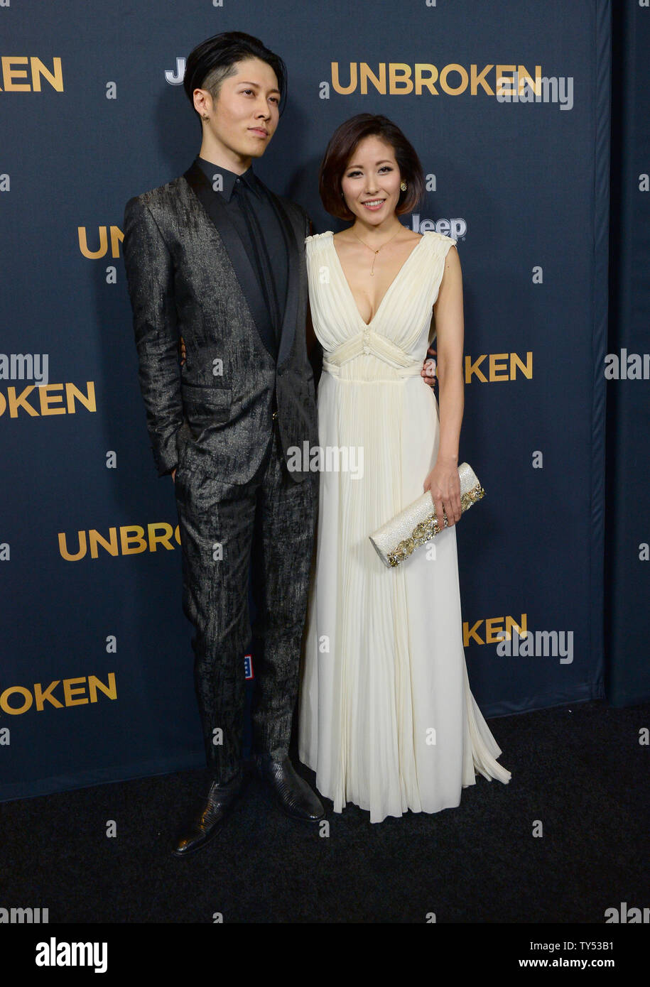 Cast member Takamasa Ishihara aka 'Miyavi' and his wife, pop singer Miyuki Ishihara attend the premiere of the biographical motion picture war drama 'Unbroken' at the Dolby Theatre in the Hollywood section of Los Angeles on December 15, 2014. Storyline: After a near-fatal plane crash in WWII, Olympian Louis Zamperini spends a harrowing 47 days in a raft with two fellow crewmen before he's caught by the Japanese navy and sent to a prisoner-of-war camp.  UPI/Jim Ruymen Stock Photo