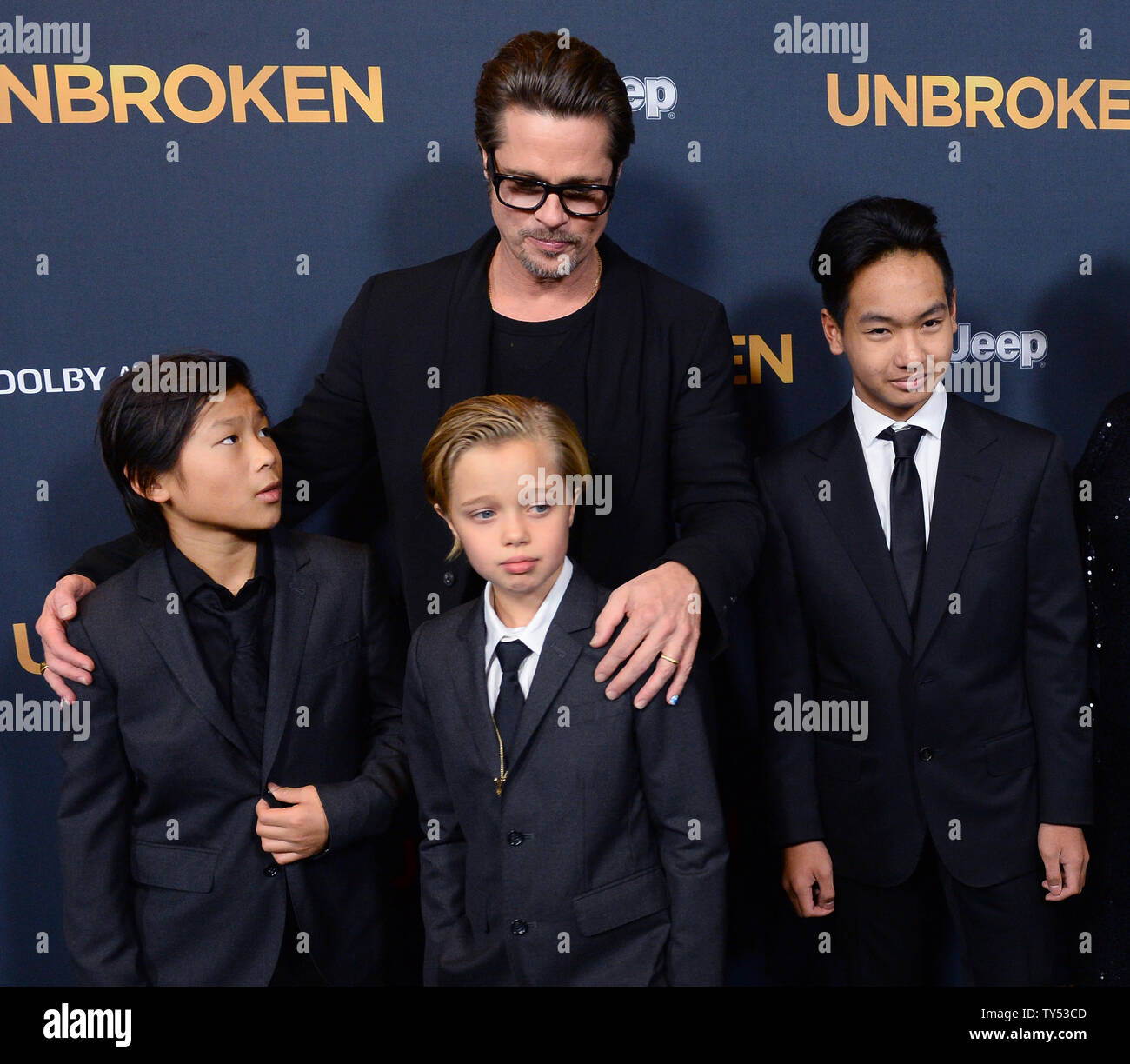 Actor Brad Pitt attends the premiere of the biographical motion picture war drama 'Unbroken' with his children Pax Thien Jolie-Pitt, Shiloh Nouvel Jolie-Pitt, Maddox Jolie-Pitt (L-R) at the Dolby Theatre in the Hollywood section of Los Angeles on December 15, 2014. Storyline: After a near-fatal plane crash in WWII, Olympian Louis Zamperini spends a harrowing 47 days in a raft with two fellow crewmen before he's caught by the Japanese navy and sent to a prisoner-of-war camp.  UPI/Jim Ruymen Stock Photo