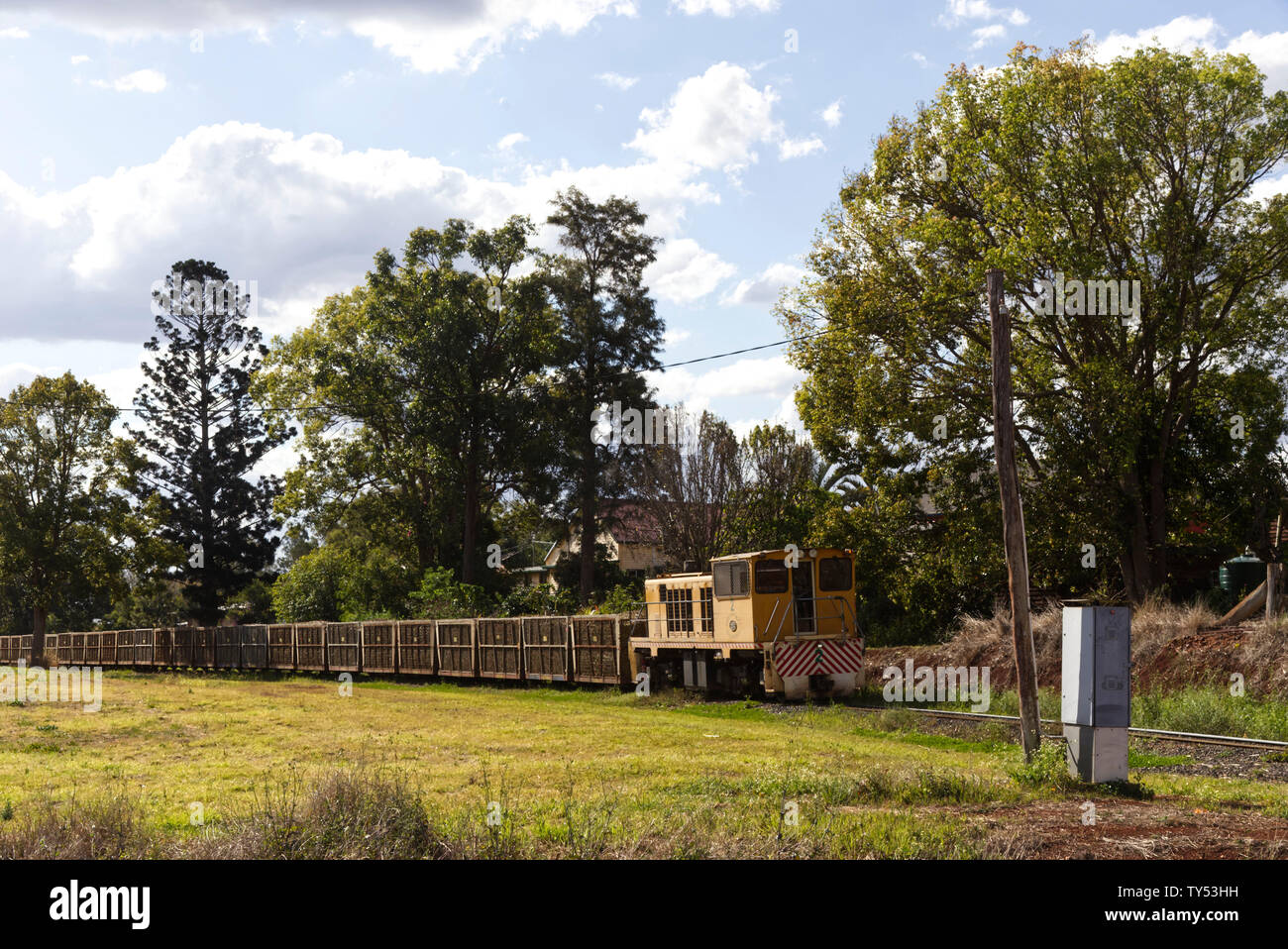 Fully loaded sugarcane train passing through Cordalba near Childers