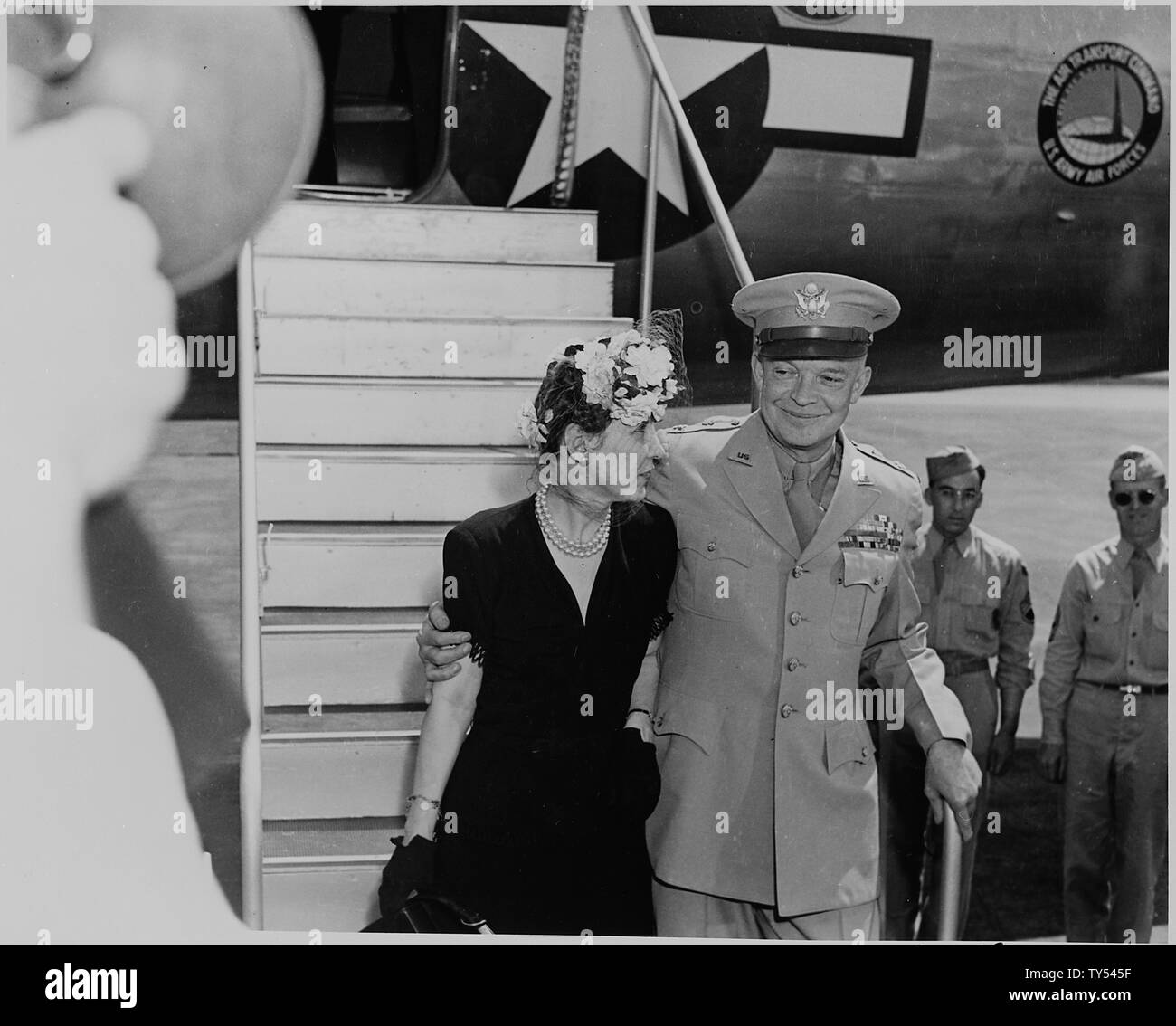 General Dwight D. and Mamie Eisenhower descending an airplane ramp, on route to a White House ceremony in which General Eisenhower will be awarded a Distinguished Service Medal by President Harry S. Truman. Stock Photo