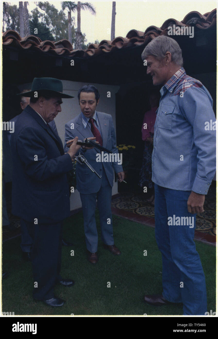 General Secretary Brezhnev meets actor Chuck Connors, at San Clemente; Scope and content:  Pictured: , Leonid Brezhnev, Viktor M. Kukhodrev, Chuck Connors. Subject: Heads of State - U.S.S.R. Stock Photo