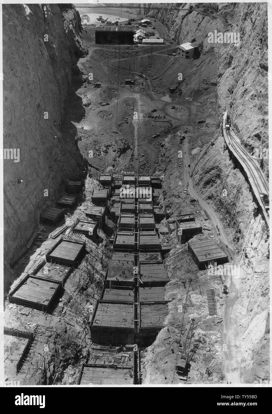 General view of operations at dam site as seen from high-level suspension bridge swung between Triangulation Points C-8 and C-7.; Scope and content:  Photograph from Volume Two of a series of photo albums documenting the construction of Hoover Dam, Boulder City, Nevada. Stock Photo
