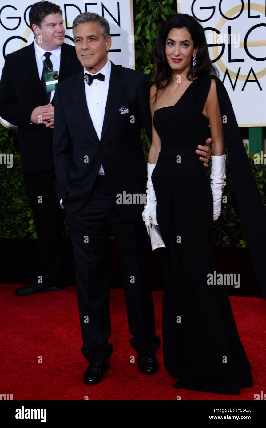 Actor Clooney (L) and attorney Amal Alamuddin Clooney attends