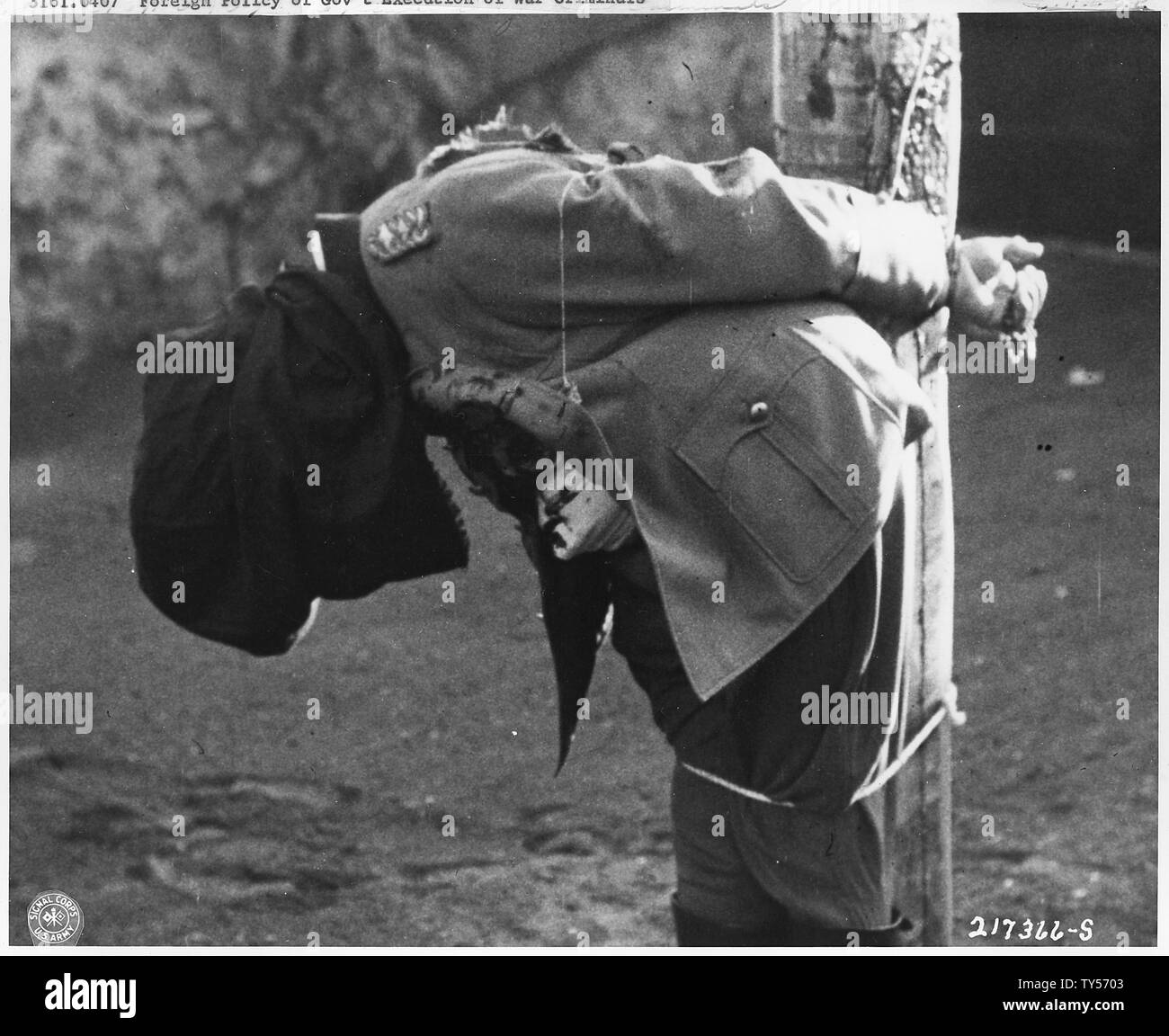 German War Crimes Trials. Nuernberg & Dachau; Scope and content:  German General Anton Dostler's body slumps toward the ground after being executed by a firing squad at Aversa, Italy. The general was convicted and sentenced to death by an American Military Tribunal. Stock Photo