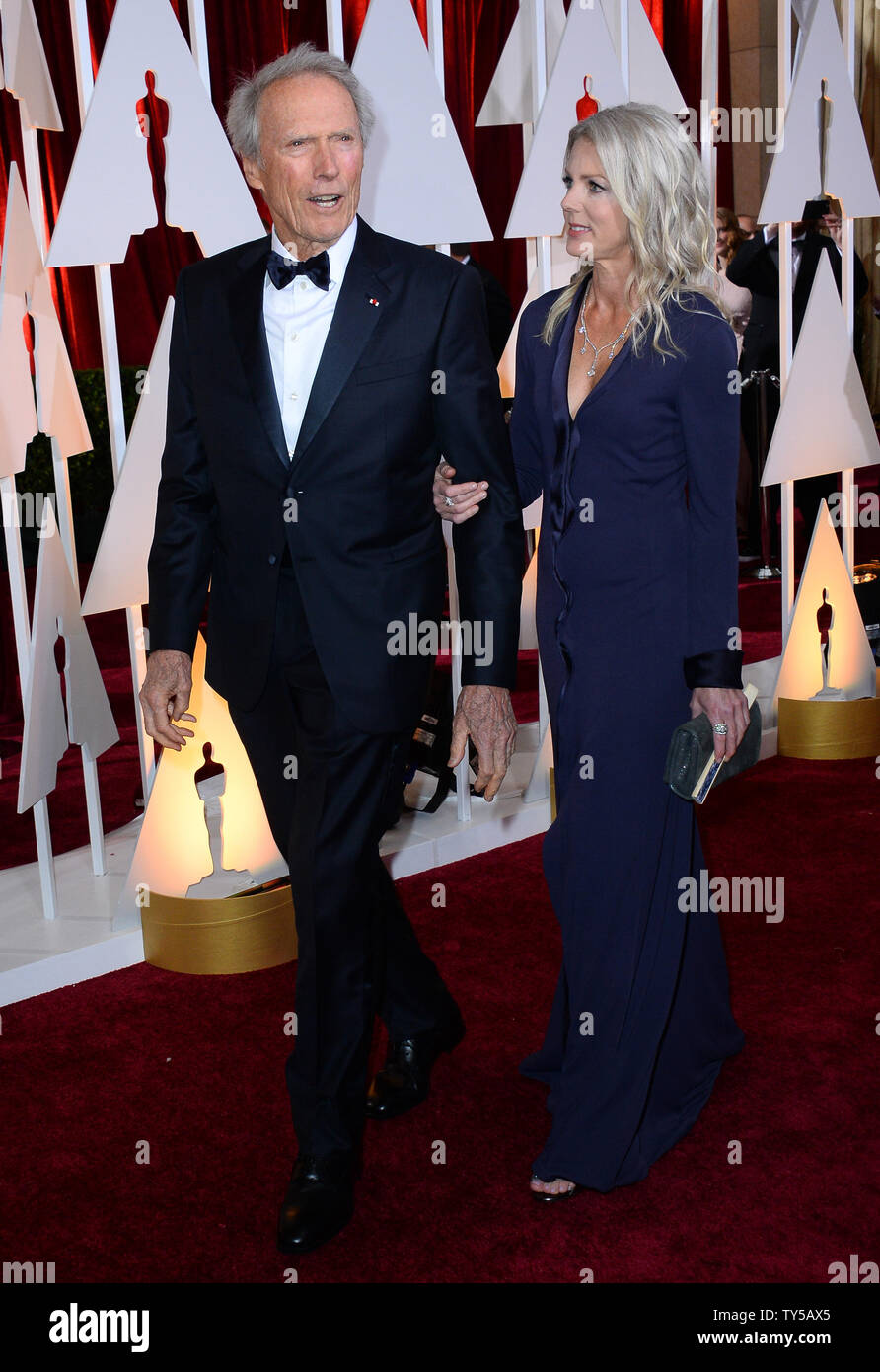 Director Clint Eastwood (L) and Christina Sandera arrive at the 87th Academy Awards at the Hollywood & Highland Center in Los Angeles on February 22, 2015. Photo by Jim Ruymen/UPI Stock Photo