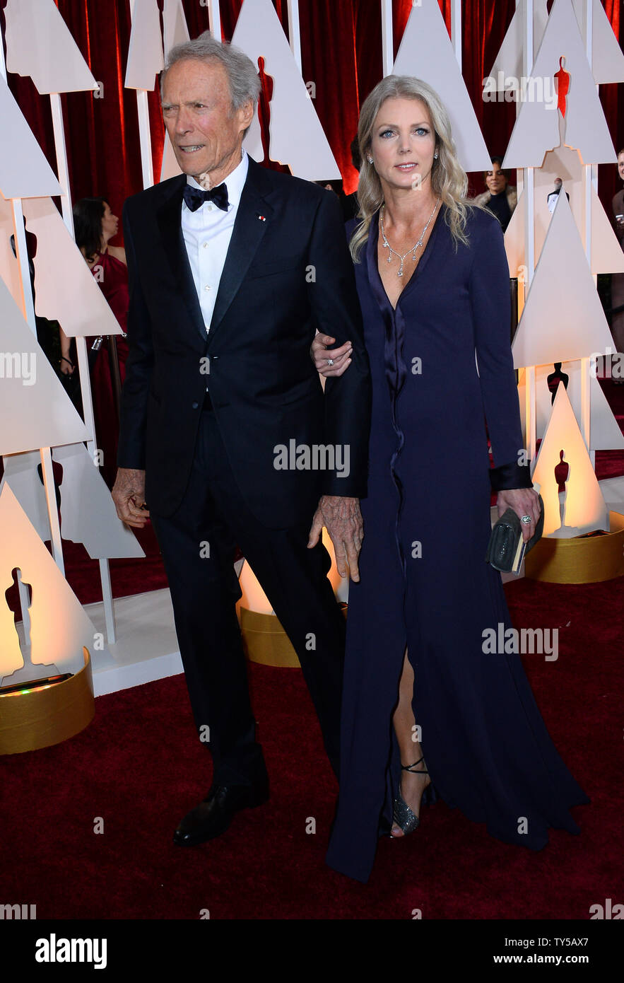 Director Clint Eastwood (L) and Christina Sandera arrive at the 87th Academy Awards at the Director Clint Eastwood (L) and Christina Sandera arrive at the 87th Academy Awards at the