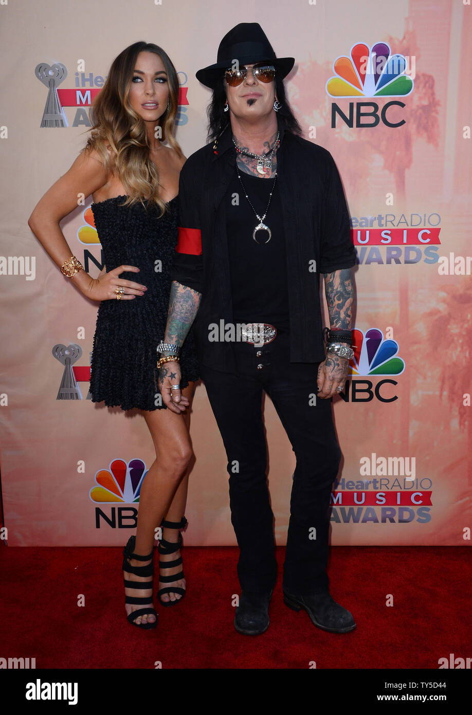 Musician Niki Sixx, right, and Courtney Bingham attend the iHeartRadio