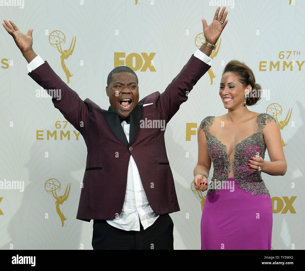 Actor Tracy Morgan (L) and wife Megan Wollover  appear in the photo room at the 67th Primetime Emmy Awards in the Microsoft Theater in Los Angeles on September 20, 2015. Morgan was a surprise presenter, returning fifteen months after an auto accident left him in a coma with numerous broken bones.     Photo by Jim Ruymen/UPI Stock Photo