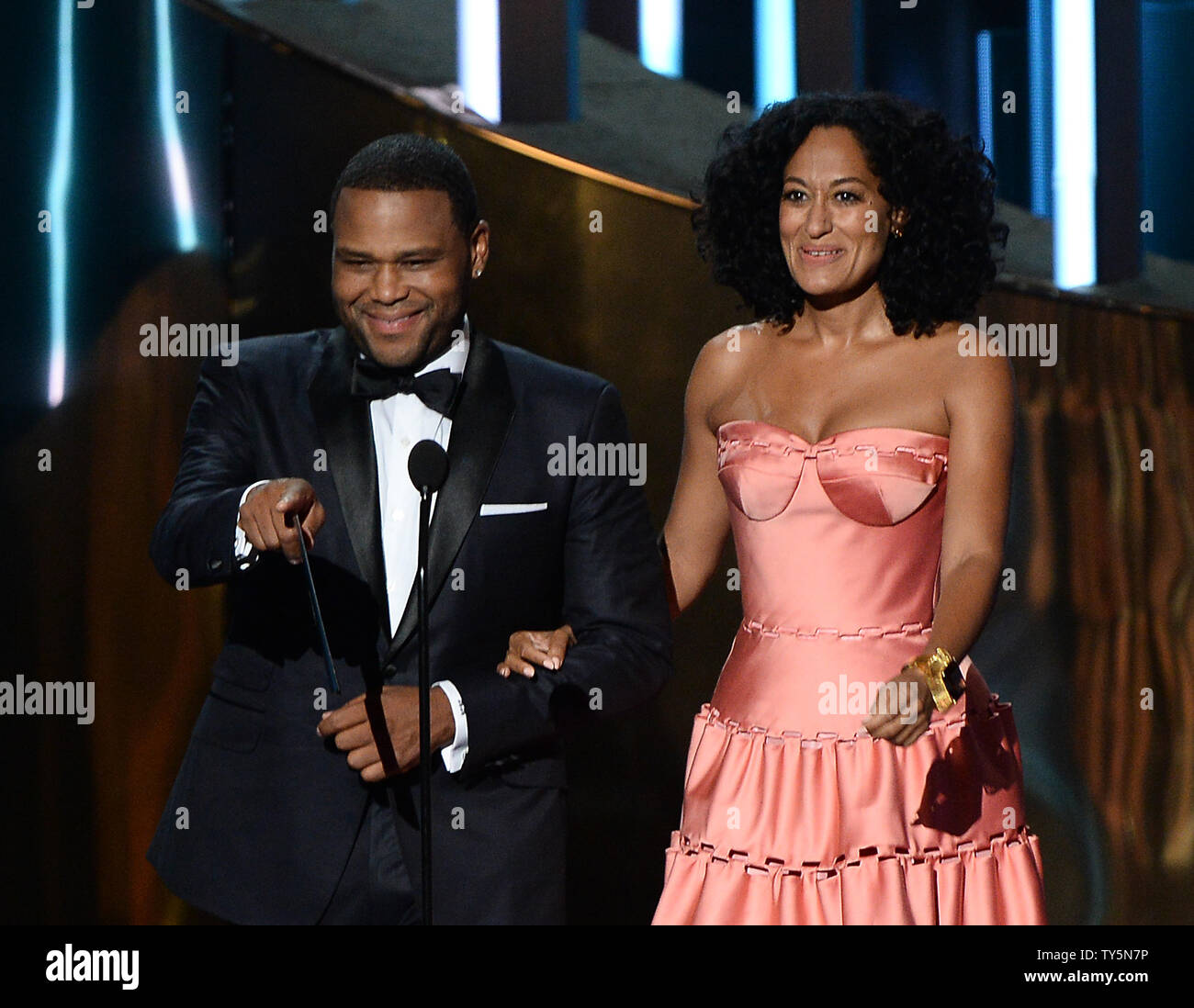 Actor Anthony Anderson (L) and actress Tracee Ellis onstage during the 67th Primetime Emmy Awards in the Microsoft Theater in Los Angeles on September 20, 2015.   Photo by Ken Matsui/UPI. Stock Photo