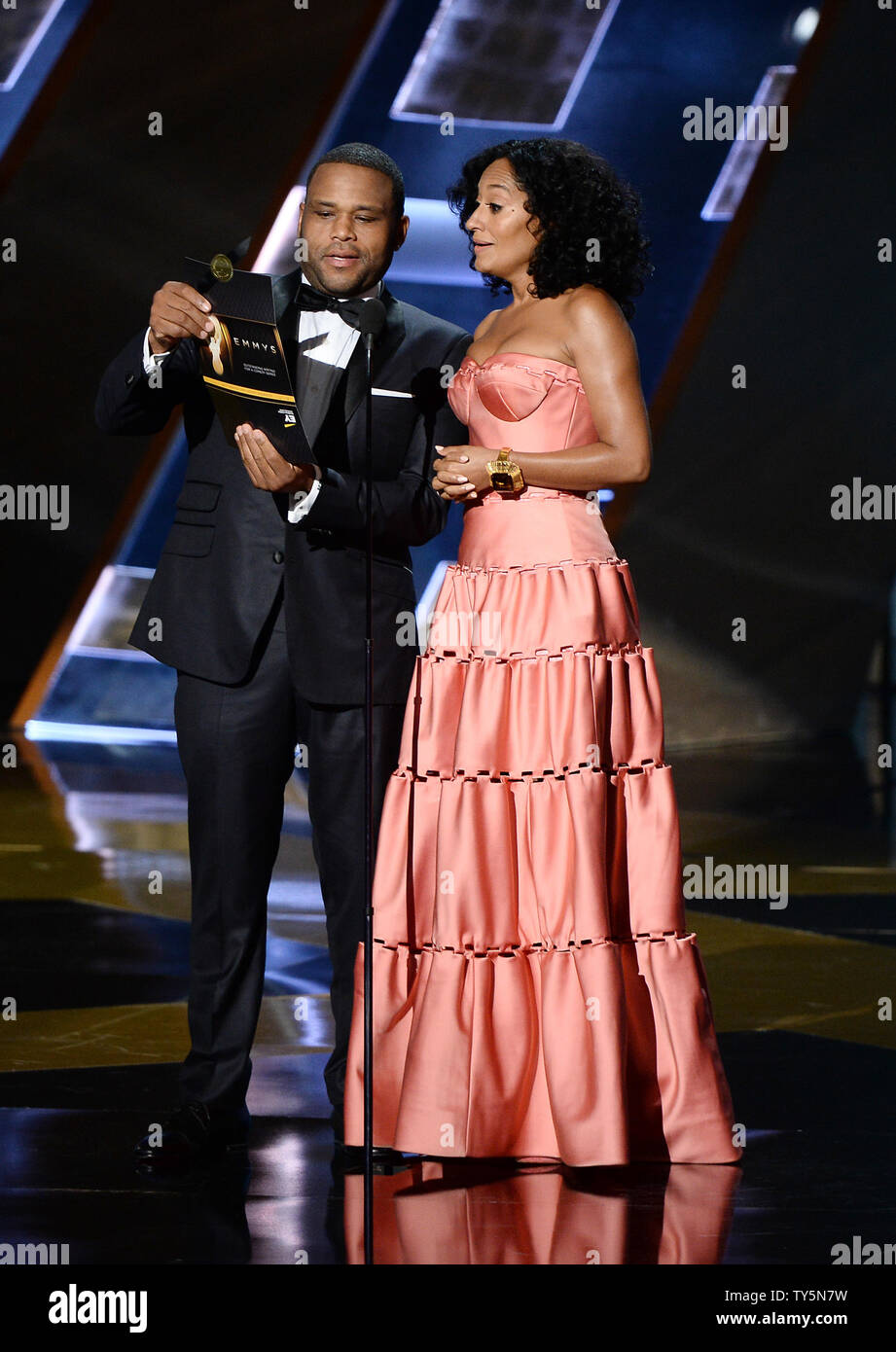 Actor Anthony Anderson (L) and actress Tracee Ellis onstage during the 67th Primetime Emmy Awards in the Microsoft Theater in Los Angeles on September 20, 2015.   Photo by Ken Matsui/UPI. Stock Photo