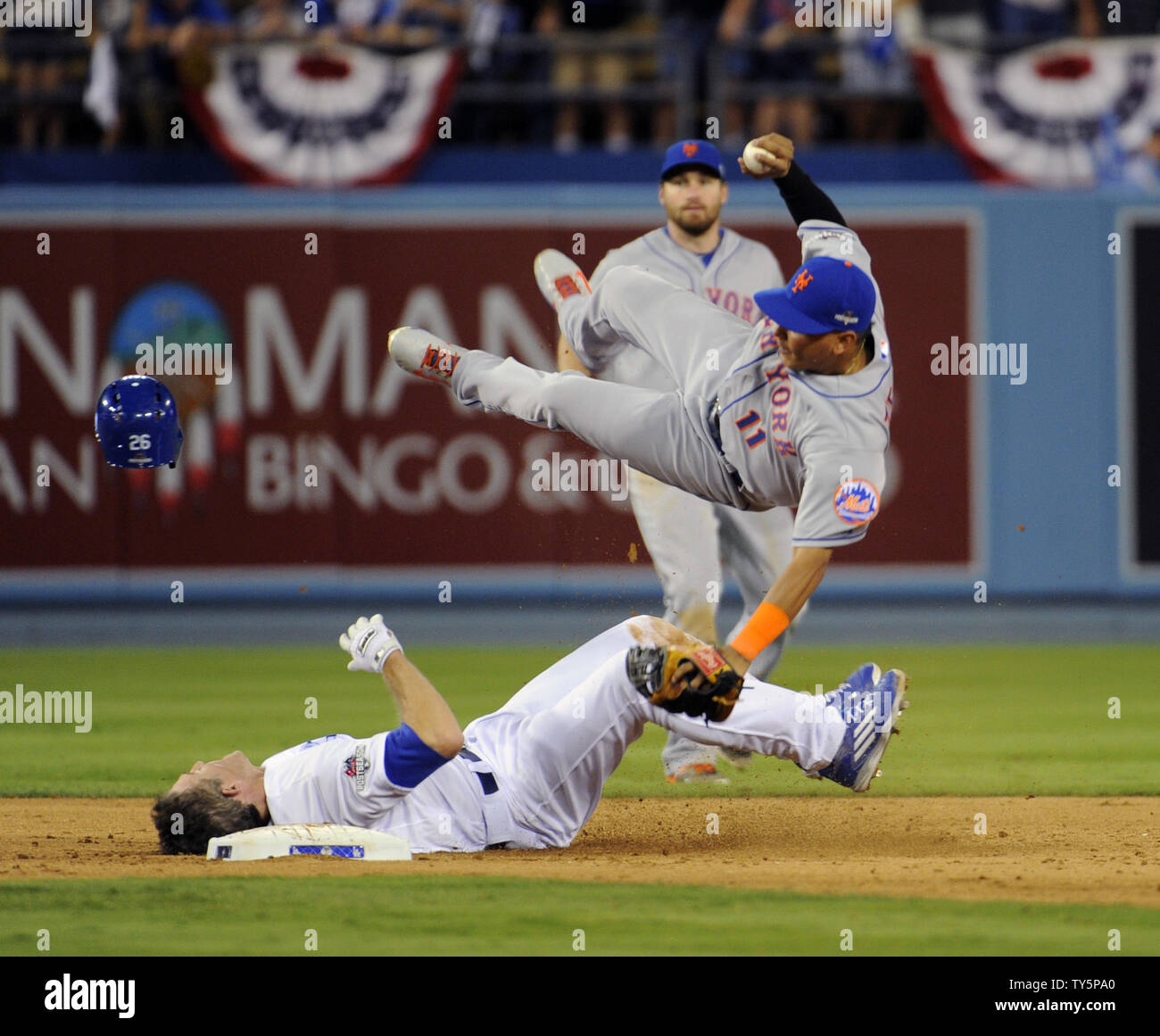 Los Angeles Dodgers' Chase Utley breaks up the double play as New York Mets' short stop Ruben Tejada goes airborne in the seventh inning in game 2 of the National League Division Series at Dodgers Stadium in Los Angeles on October10, 2015. Tejada suffered a fractured right fibula on the play. Photo by Lori Shepler/UPI Stock Photo