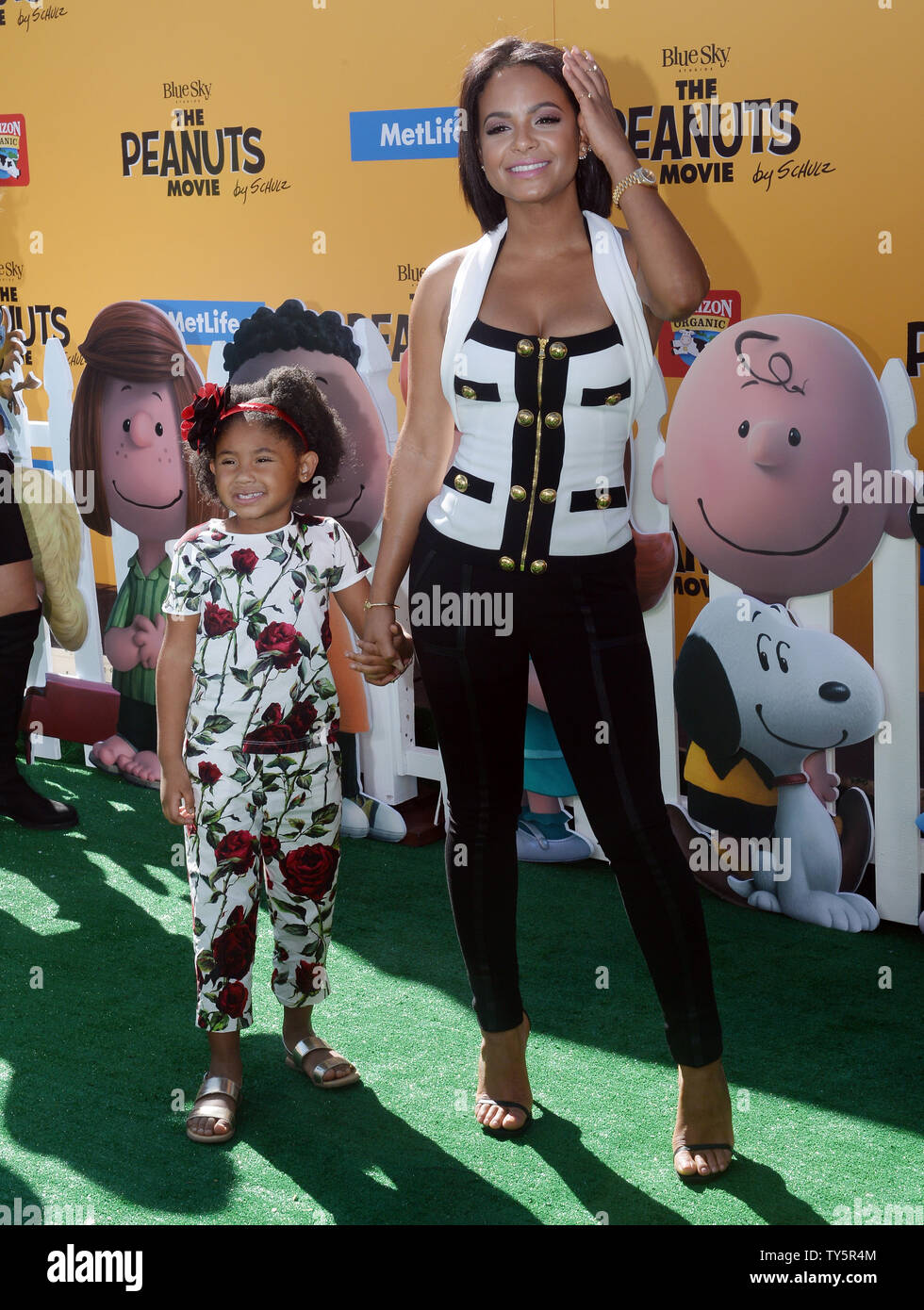 Actress Christina Milian and her daughter Violet attend the premiere of