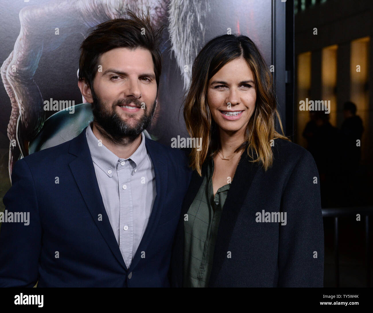 Cast member Adam Scott and his wife, writer Naomi Scott attend an industry  screening of the motion picture horror comedy "Krampus" at the Arclight  Cinerama Dome in the Hollywood section of Los