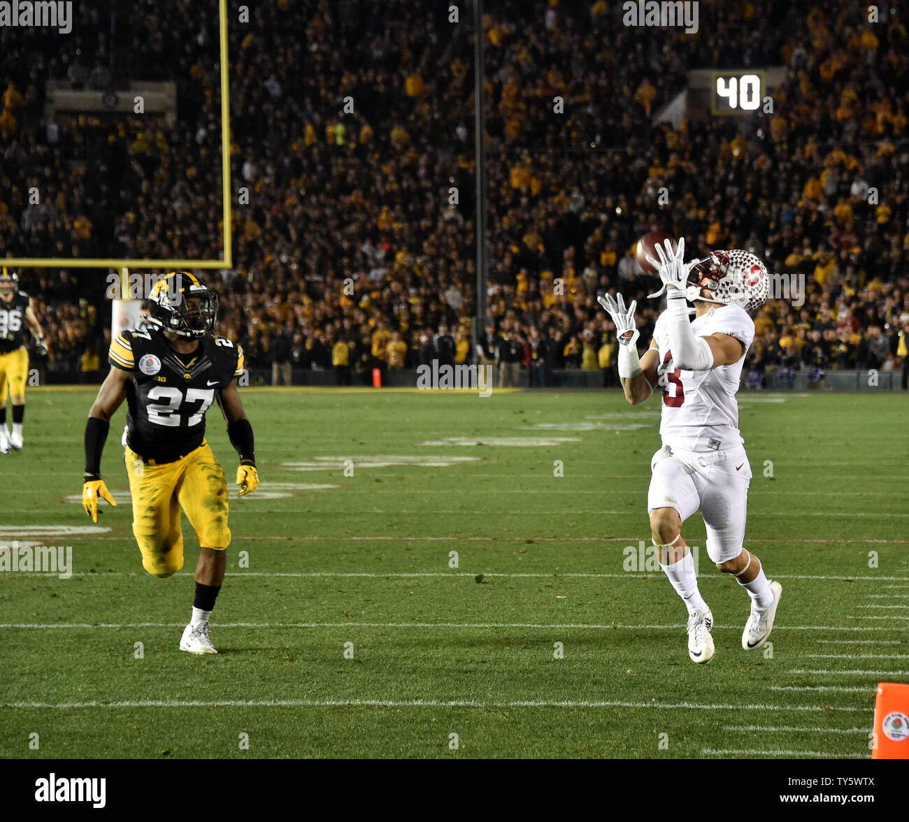 Stanford Cardinal receiver Michael Rector (3) hauls in touchdown pass by Iowa Hawkeyes' defensive back Jordan Lomax during fourth quarter of the 102nd Rose Bowl game in Pasadena, California on January 1, 2016.The Cardinal beat the Hawkeyes 45-16.  Photo by Jon SooHoo/UPI Stock Photo