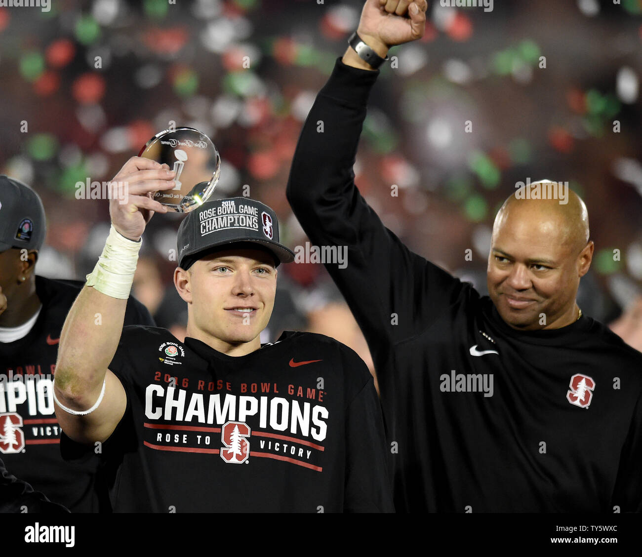 Christian McCaffrey #5 of the Stanford Cardinal holds up the Rose Bowl Game's MVP trophy as head coach David Shaw looks on. The Stanford Cardinal defeated the Iowa Hawkeyes, 45-16, in the 102nd Rose Bowl game in Pasadena, California on January 1, 2016.  Photo by Juan Ocampo/UPI Stock Photo