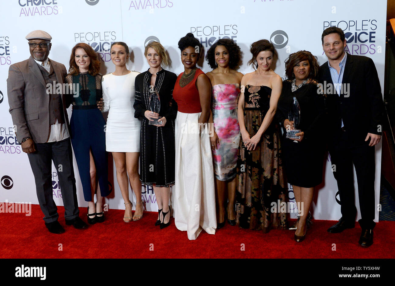 From Left Actors James Pickens Jr Sarah Drew Camilla Luddington Ellen Pompeo Jerrika Hinton Kelly Mccreary Caterina Scorsone Chandra Wilson And Justin Chambers Appear Backstage With Their Award For Favorite Network Tv