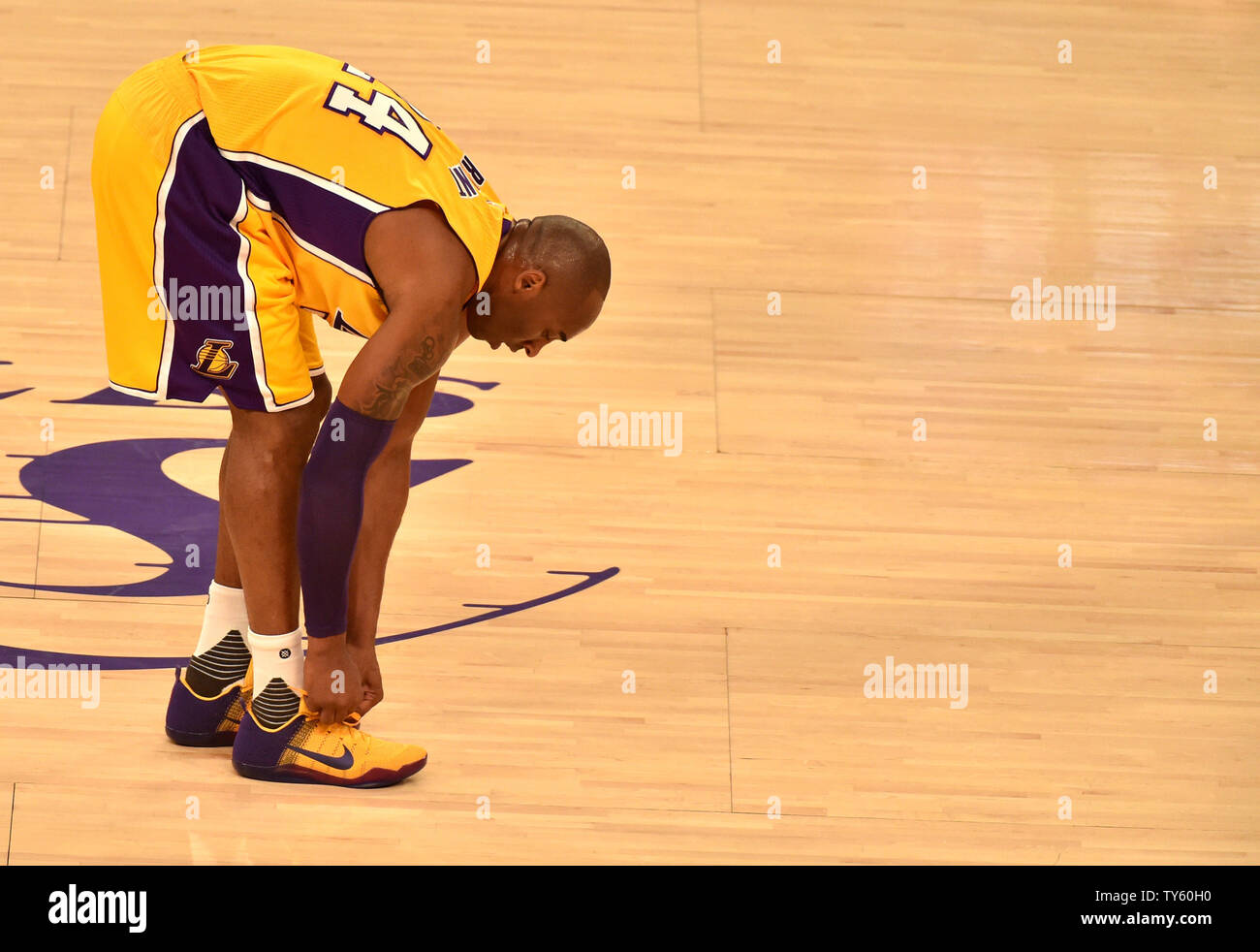 Los Angeles Lakers Kobe Bryant ties his shoe during game against the San Antonio Spurs at Staples Center in Los Angeles on January 22, 2016. Photo by Jon SooHoo/UPI Stock Photo