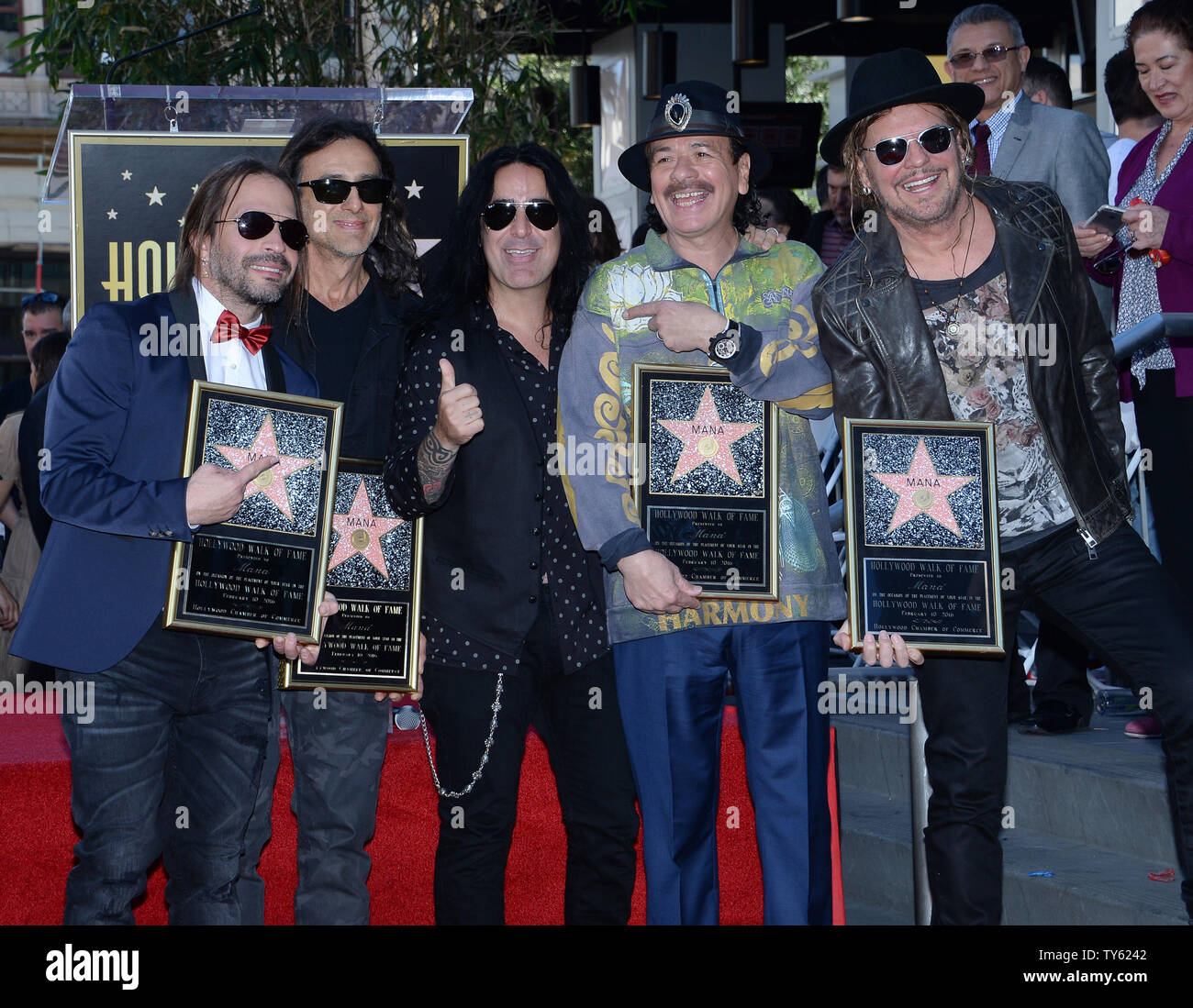 Carlos Santana, 4th left  joins Alex Gonzalez, Sergio Vallin, Juan Calleros and Fher Olvera (L-R), members of the Mexican rock band Mana during an unveiling ceremony honoring the group with the 2,573rd star on the Hollywood Walk of Fame in Los Angeles on February 10, 2016. Photo by Jim Ruymen/UPI Stock Photo