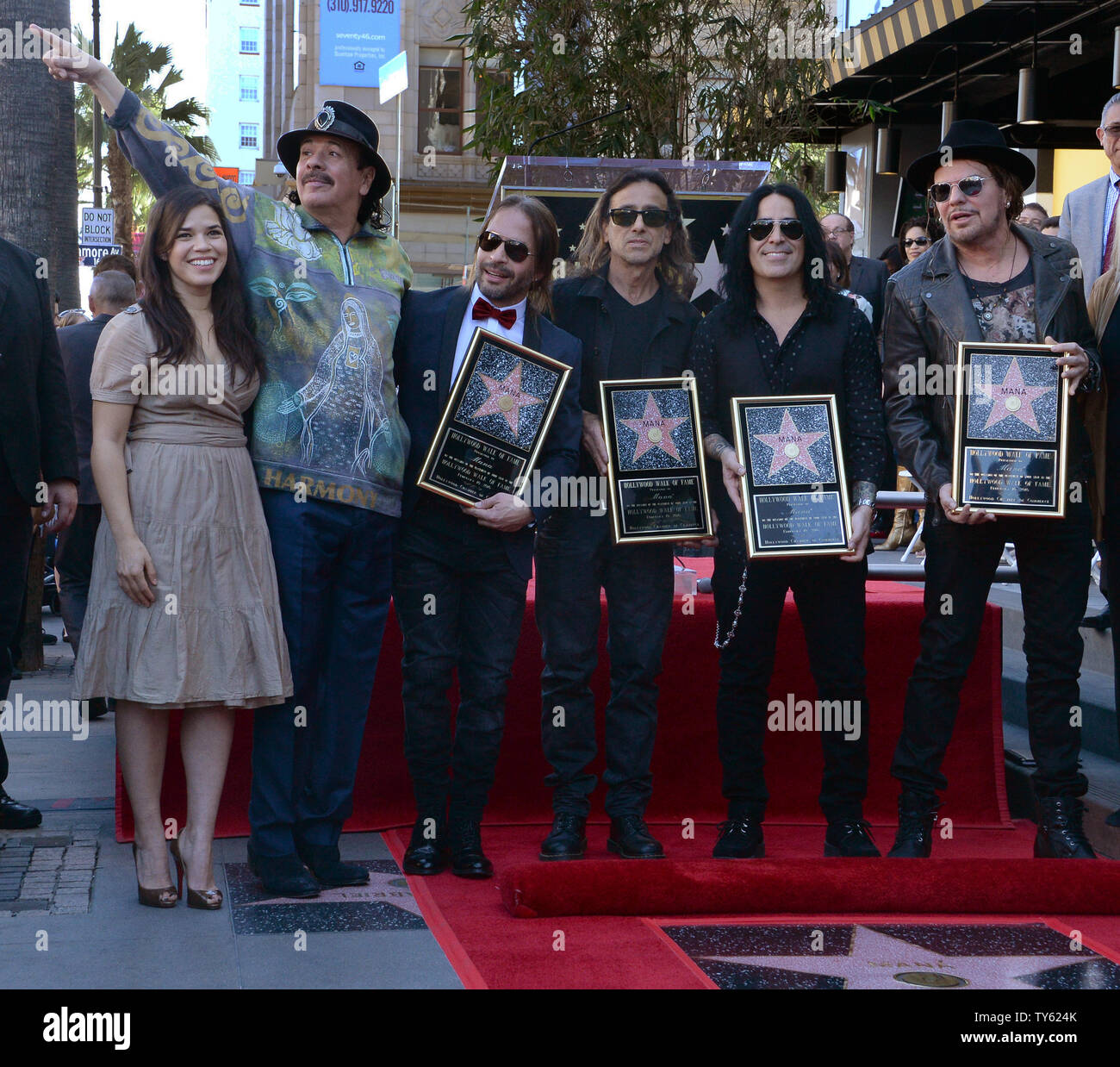 Actress America Ferrera and musician Carlos Santana join Alex Gonzalez, Sergio Vallin, Juan Calleros and Fher Olvera (L-R), members of the Mexican rock band Mana during an unveiling ceremony honoring the group with the 2,573rd star on the Hollywood Walk of Fame in Los Angeles on February 10, 2016. Photo by Jim Ruymen/UPI Stock Photo