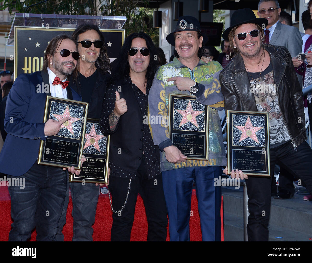 Carlos Santana, 4th left  joins Alex Gonzalez, Sergio Vallin, Juan Calleros and Fher Olvera (L-R), members of the Mexican rock band Mana during an unveiling ceremony honoring the group with the 2,573rd star on the Hollywood Walk of Fame in Los Angeles on February 10, 2016. Photo by Jim Ruymen/UPI Stock Photo