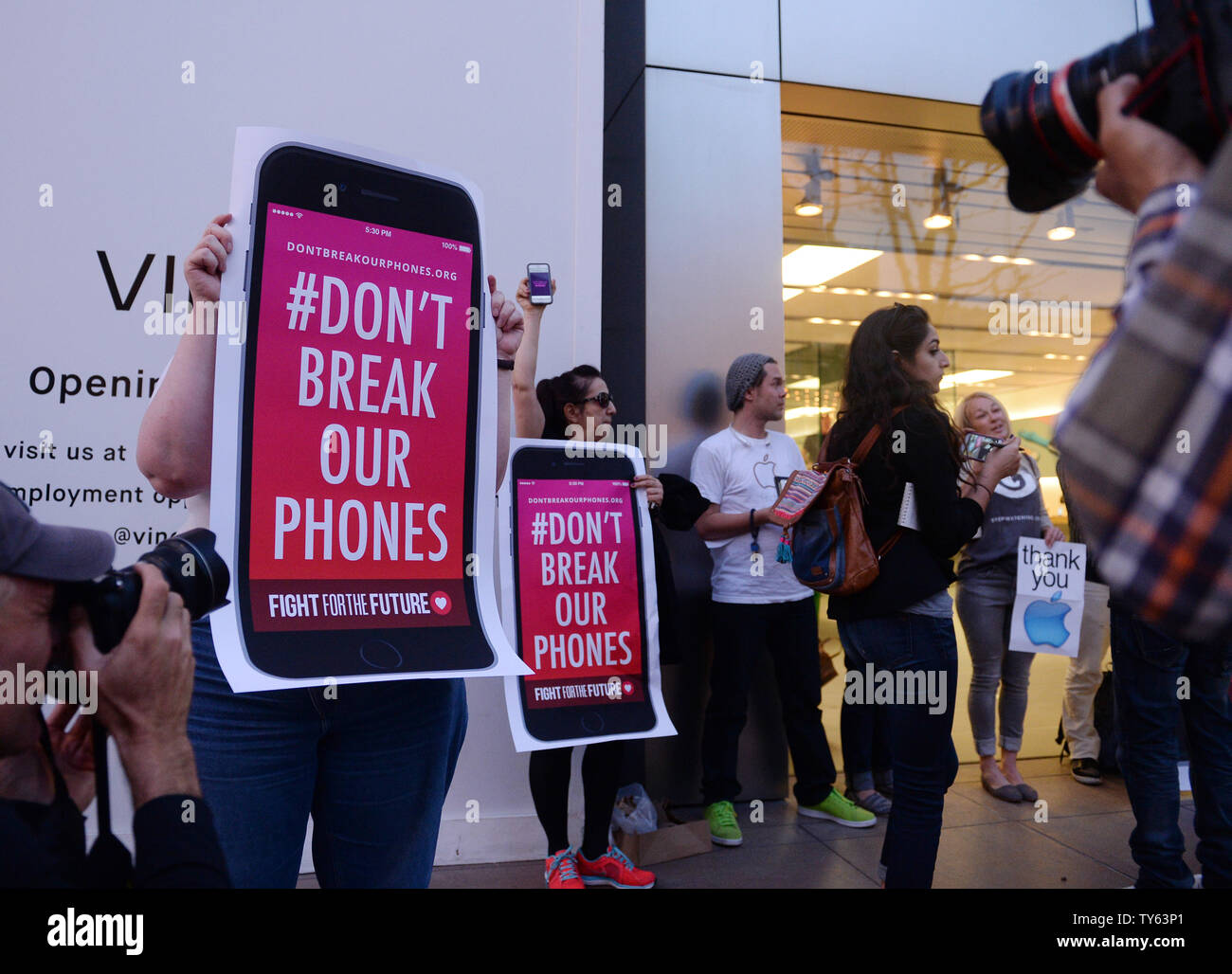 Privacy activists gather outside an Apple Store to defend the corporation in its battle with the FBI at The Grove in Los Angeles on February 23, 2016.  The activists support the company's refusal to help the FBI access the contents of the I-phone that belonged to the gunman who, with his wife, killed 14 people at the Inland Regional Center in San Bernardino back on December. Photo by Jim Ruymen/UPI Stock Photo