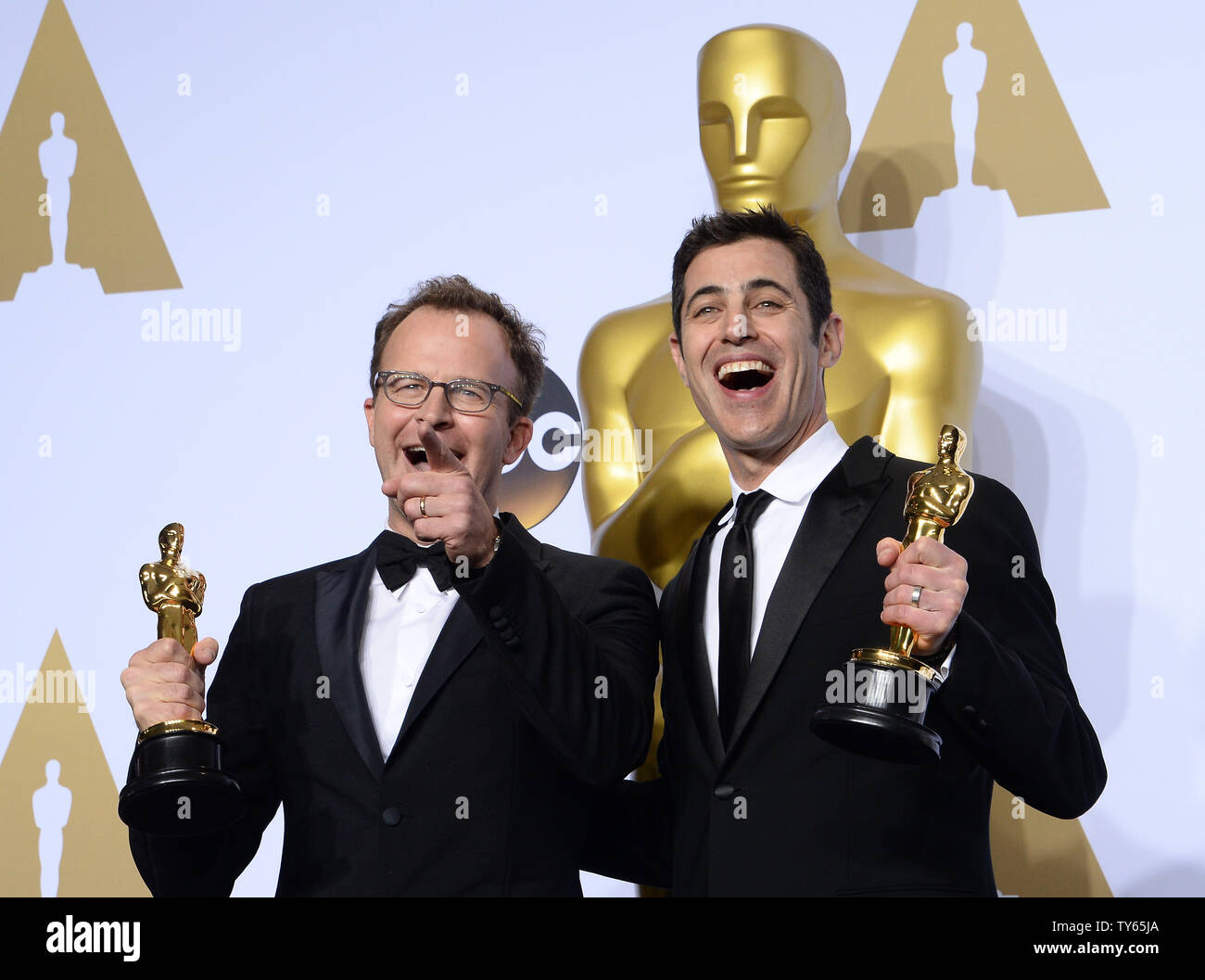 Screenwriters Tom McCarthy, left, and Josh Singer appear backstage with ...