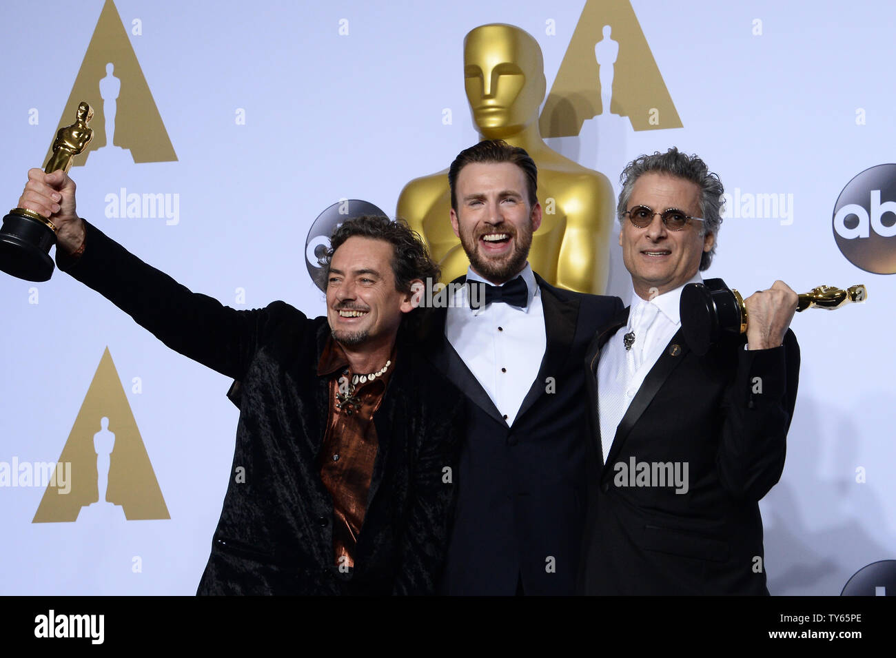 Actor Chris Evans, center, and sound editors David White and Mark