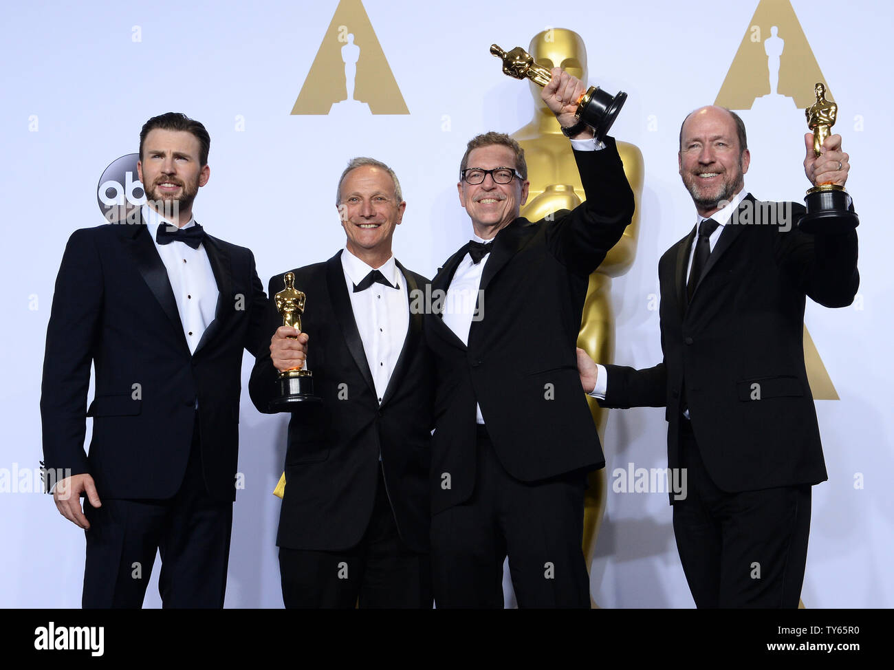 Actor Chris Evans, left, and sound mixers Ben Osmo, Gregg Rudloff, center, and Chris Jenkins, right, winners of the Best Sound Mixing award for 'Mad Max: Fury Road,' appear backstage at the 88th Academy Awards, at the Hollywood and Highland Center in the Hollywood section of Los Angeles on February 28, 2016.  Photo by Jim Ruymen/UPI Stock Photo