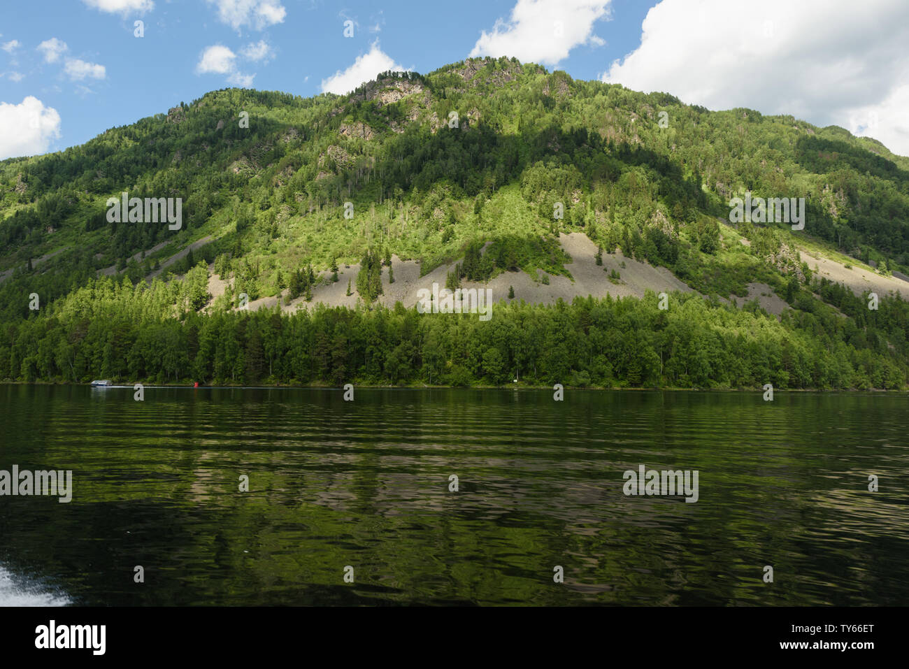 a trip along Teletskoye Lake on a motorboat in the Altai Mountains Stock Photo