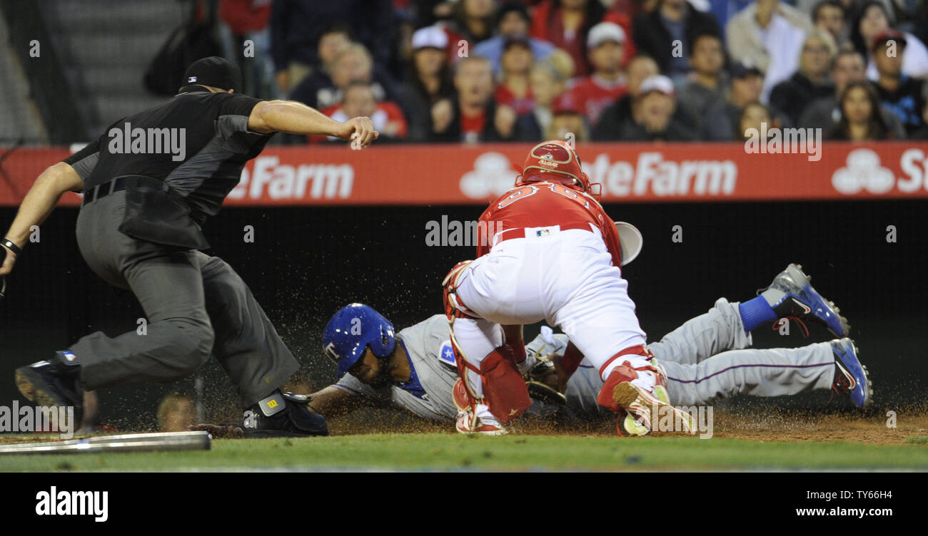 Los Angeles Angels catcher Carlos Perez tags out Texas Rangers' Elvis Andrus at home plate  in the 4th inning at Angel Stadium in Anaheim, California on April 9, 2016. The Rangers won 4 to 1. Photo by Lori Shepler/UPI. Stock Photo