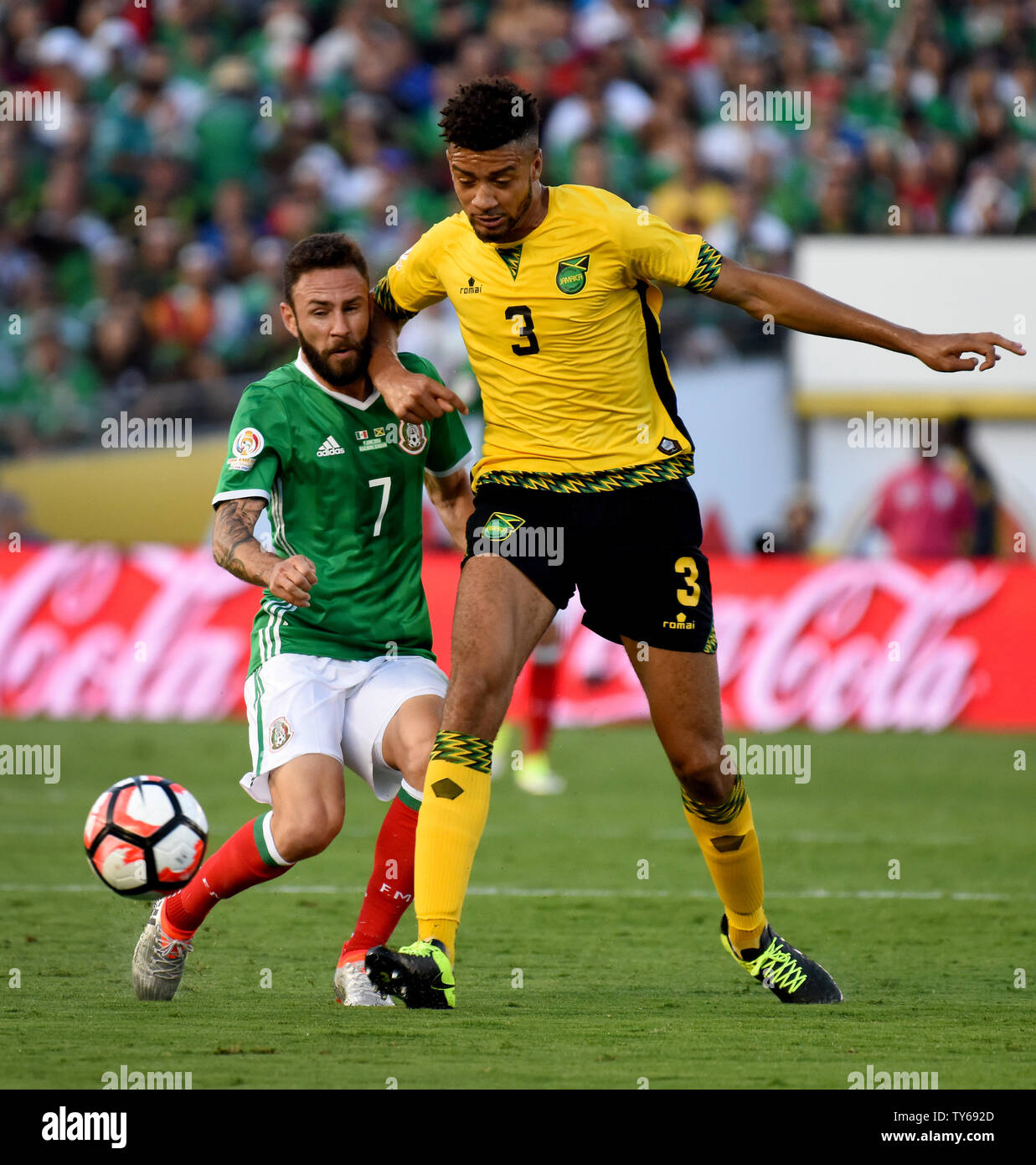 Mexico's defender Miguel Layún (7) gets and elbow to the head from Jamaica defender Michael Hector (3) during the first half of a 2016 Copa America Centenario Group A match at the Rose Bowl in Pasadena, California, on June 9, 2016.      Photo by Michael Owen Baker/UPI Stock Photo