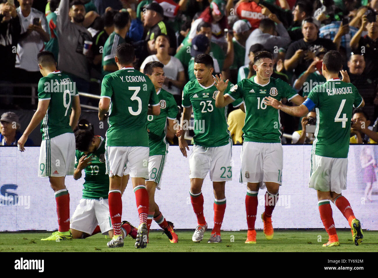 Mexico celebrates the second-half goal by forward Oribe Peralta, second from left kneeling, against Jamaica during a 2016 Copa America Centenario Group A match at the Rose Bowl in Pasadena, California, on June 9, 2016. Mexico defeated Jamaica 2-0.      Photo by Michael Owen Baker/UPI Stock Photo