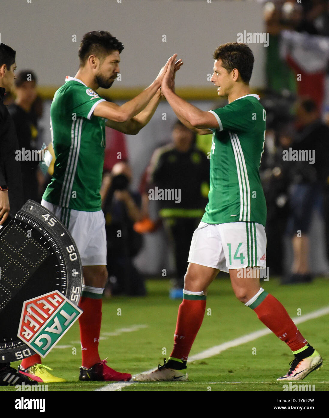 Mexico forward Oribe Peralta, left, comes into the game for Chicharito during the second half against Jamaica in a 2016 Copa America Centenario Group A match at the Rose Bowl in Pasadena, California, on June 9, 2016. Peralta scored a second-half goal and Chicharito scored in the first half as Mexico defeated Jamaica 2-0.        Photo by Michael Owen Baker/UPI Stock Photo