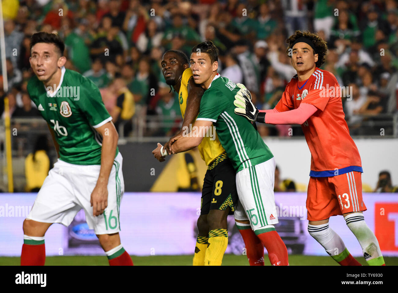 Jamaica forward Clayton Donaldson (8) is defended by Mexico defender Héctor Moreno (15) in front of the net on a corner kick during the second half of a 2016 Copa America Centenario Group A match at the Rose Bowl in Pasadena, California, on June 9, 2016. At left is Mexico midfielder Héctor Herrera and at right is Mexico goalkeeper Guillermo Ochoa. Mexico defeated Jamaica 2-0.     Photo by Michael Owen Baker/UPI Stock Photo