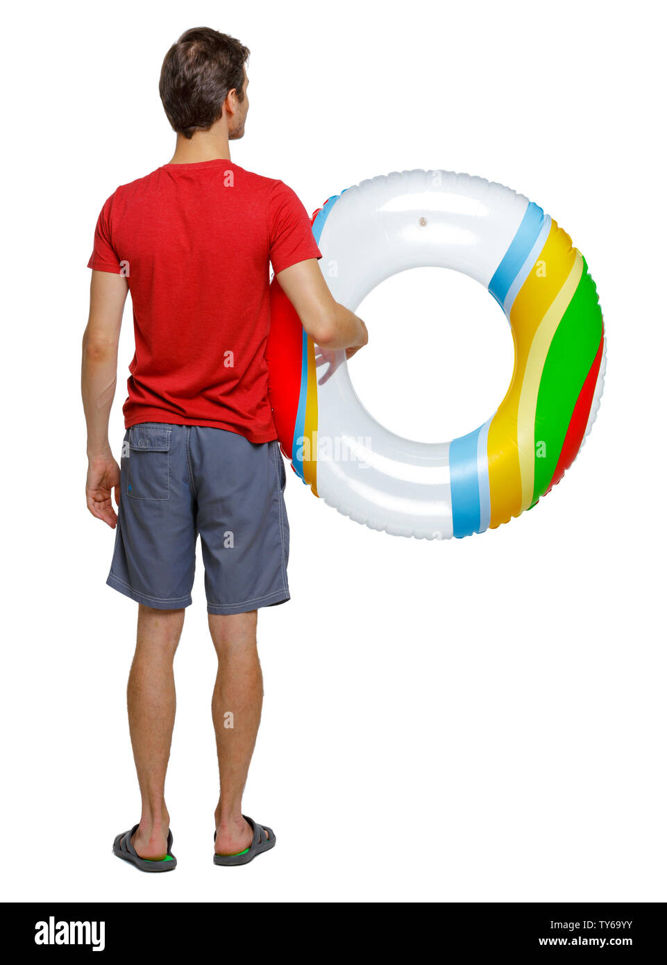 Back view of man in shorts with an inflatable circle. guy on the beach. Rear view people collection. backside view of person. Isolated over white back Stock Photo