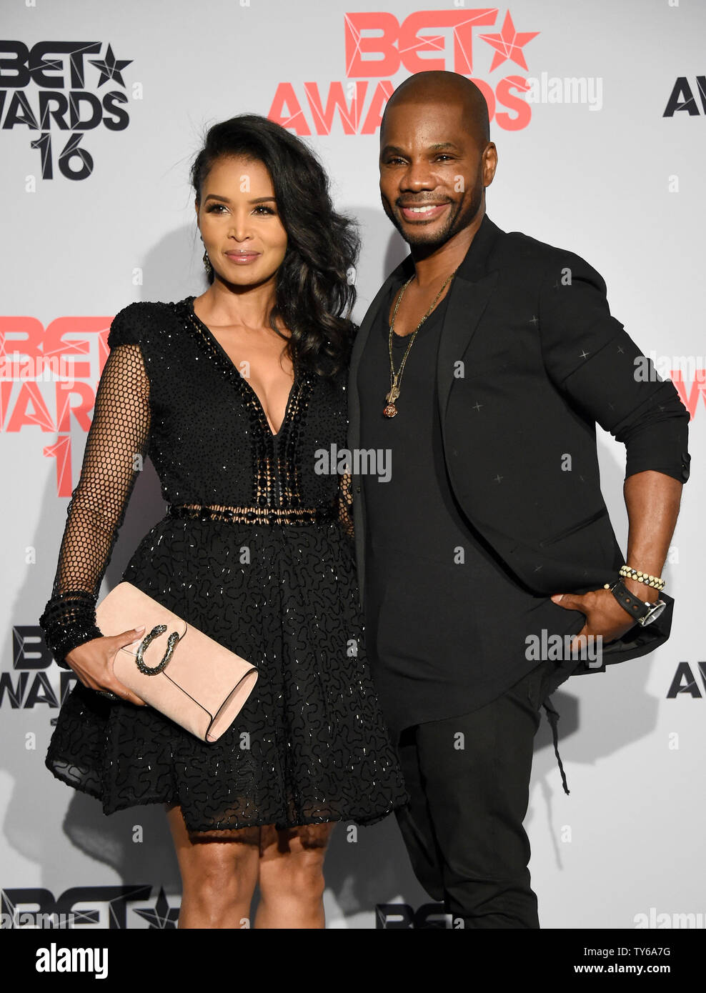 (L-R) Tammy Collins and singer Kirk Franklin appear backstage during ...