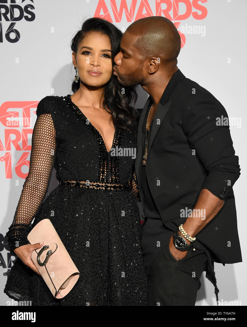 (L-R) Tammy Collins and singer Kirk Franklin appear backstage during ...