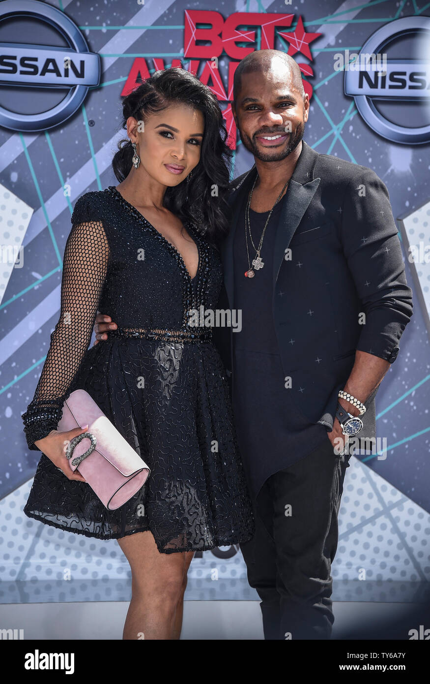 (L-R) Tammy Collins and singer Kirk Franklin attend the 16th annual BET
