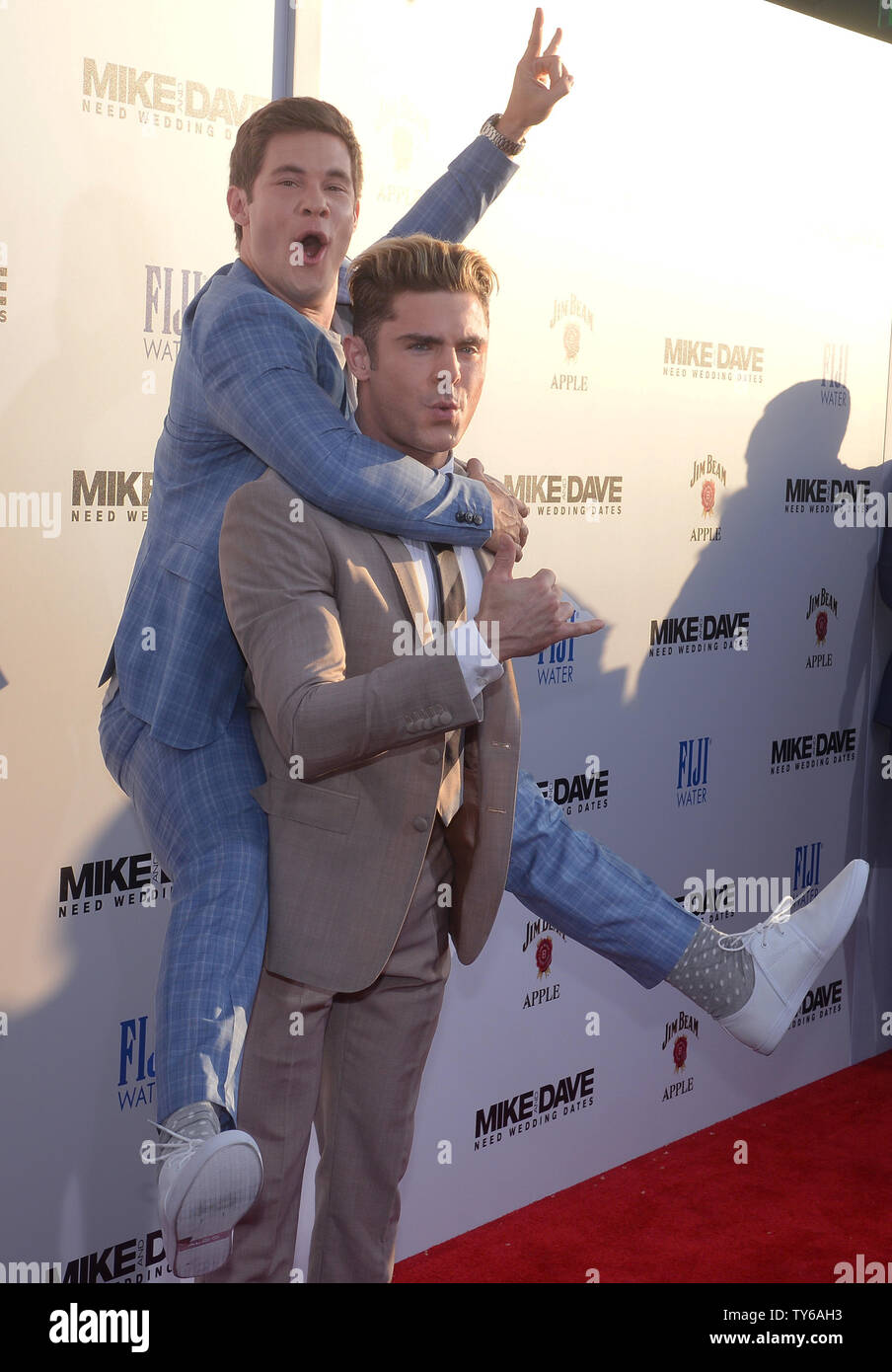 Cast members Adan Devine (L) and Zac Efron attend the premiere of the  motion picture comedy 