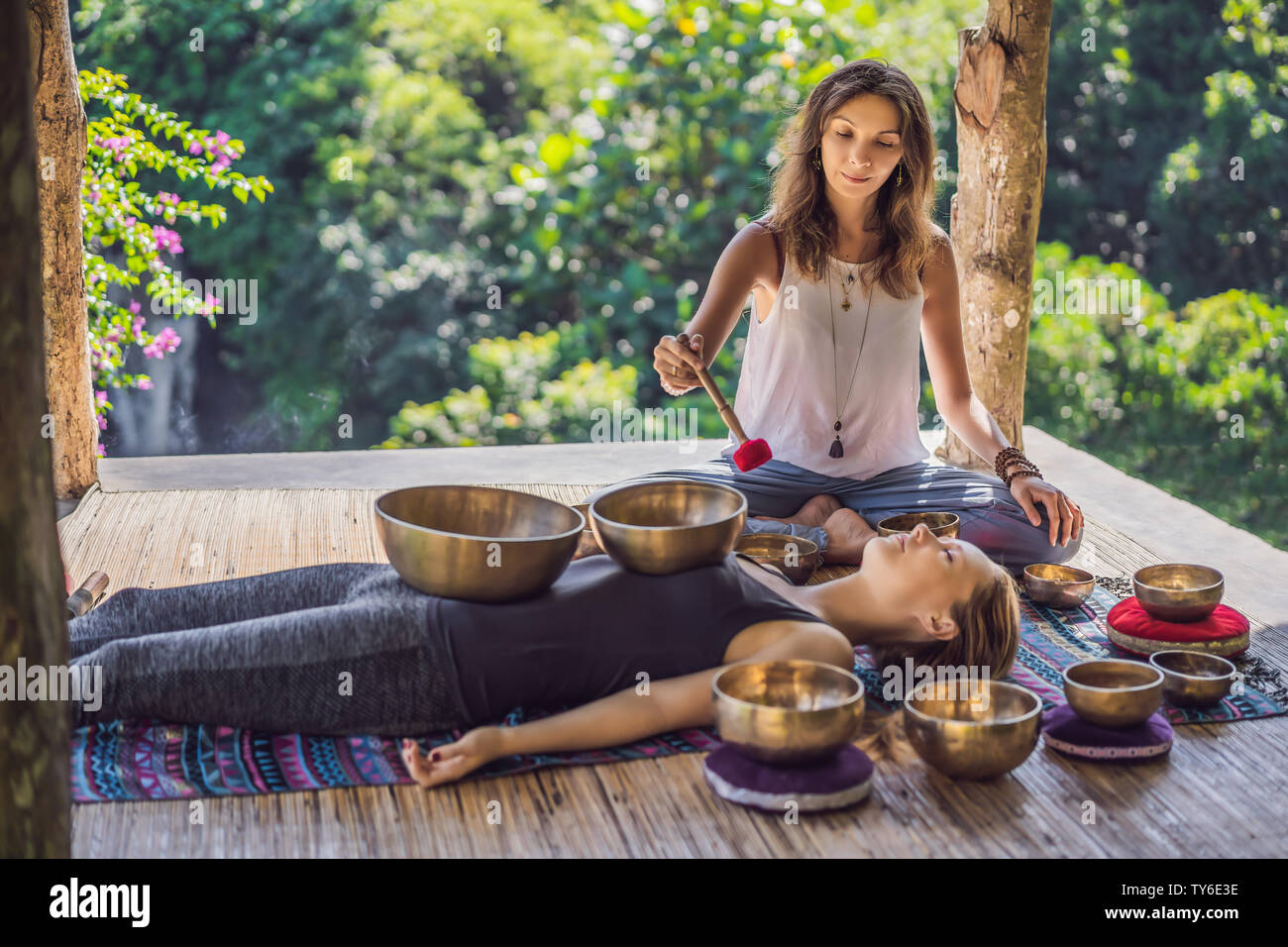 Nepal Buddha Copper Singing Bowl At Spa Salon Young Beautiful Woman Doing Massage Therapy Singing Bowls In The Spa Against A Waterfall Sound Therapy Stock Photo Alamy