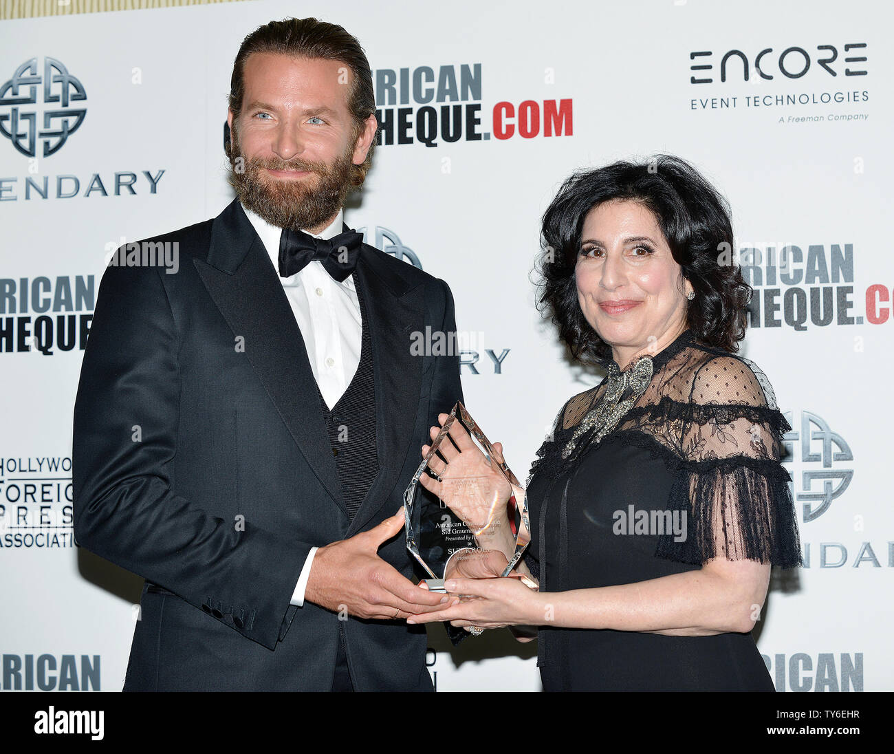 Bradley Cooper (L) presents Sue Kroll with the 2nd Annual Sid Grauman Award at the American Cinematheque's annual award show at the Beverly Hilton in Beverly Hills, California on October 14, 2016. The event is a fundraiser to benefit the community film programs of the American Cinematheque, a non-profit viewer-supported arts organization that preserves the historic Egyptian Theatre on Hollywood Boulevard and the Aero Theatre in Santa Monica. Photo by Christine Chew/UPI Stock Photo