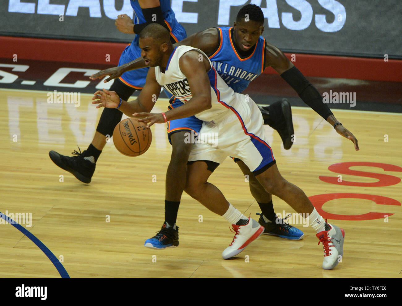 Los Angeles Clippers guard Chris Paul (L) dribbles by Oklahoma City Thunder guard Victor Oladipo during the first half of their NBA game at Staples Center in Los Angeles, November 2, 2016. The Thunder defeated the Clippers 85-83.  Photo by Jon SooHoo/ UPI. Stock Photo