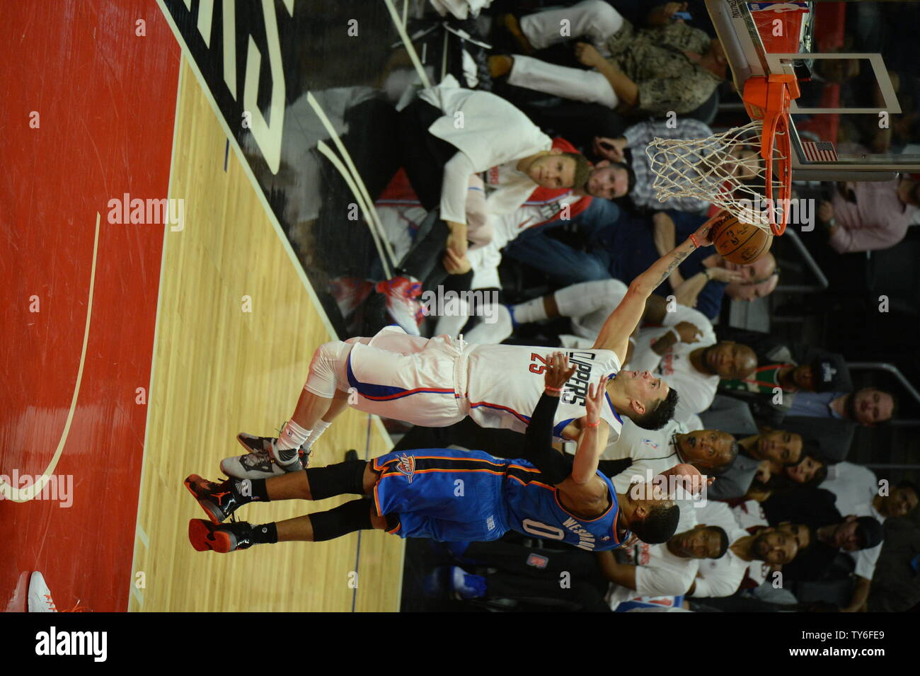 Los Angeles Clippers guard Austin Rivers (L) drives by Oklahoma City ...