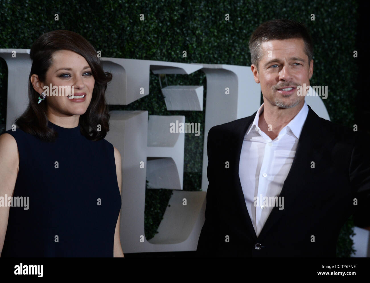 Cast members Marion Cotillard and Brad Pitt attend the premiere of the  motion picture romantic war thriller "Allied" at the Regency Village  Theatre in the Westwood section of Los Angeles on November