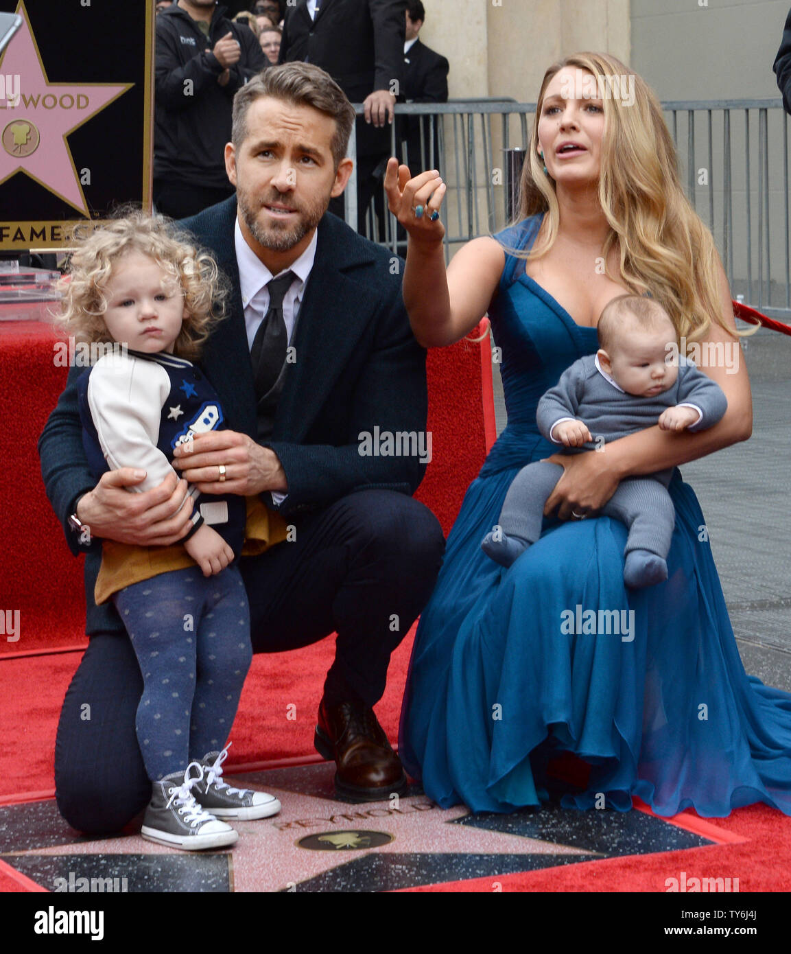 Actor Ryan Reynolds is joined by his wife, actress Blake Lively and their  daughters James (L) and yet-to be named newborn during an unveiling  ceremony honoring Reynolds with the 2,596th star on