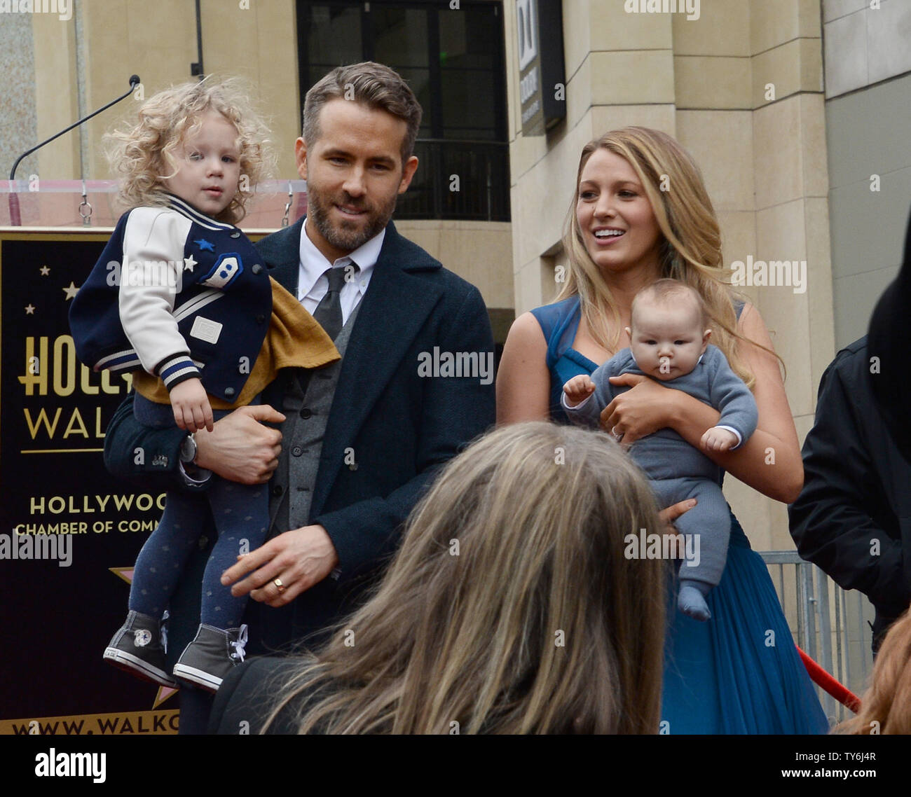 Ryan Reynolds and Blake Lively pose for photos with their newborn