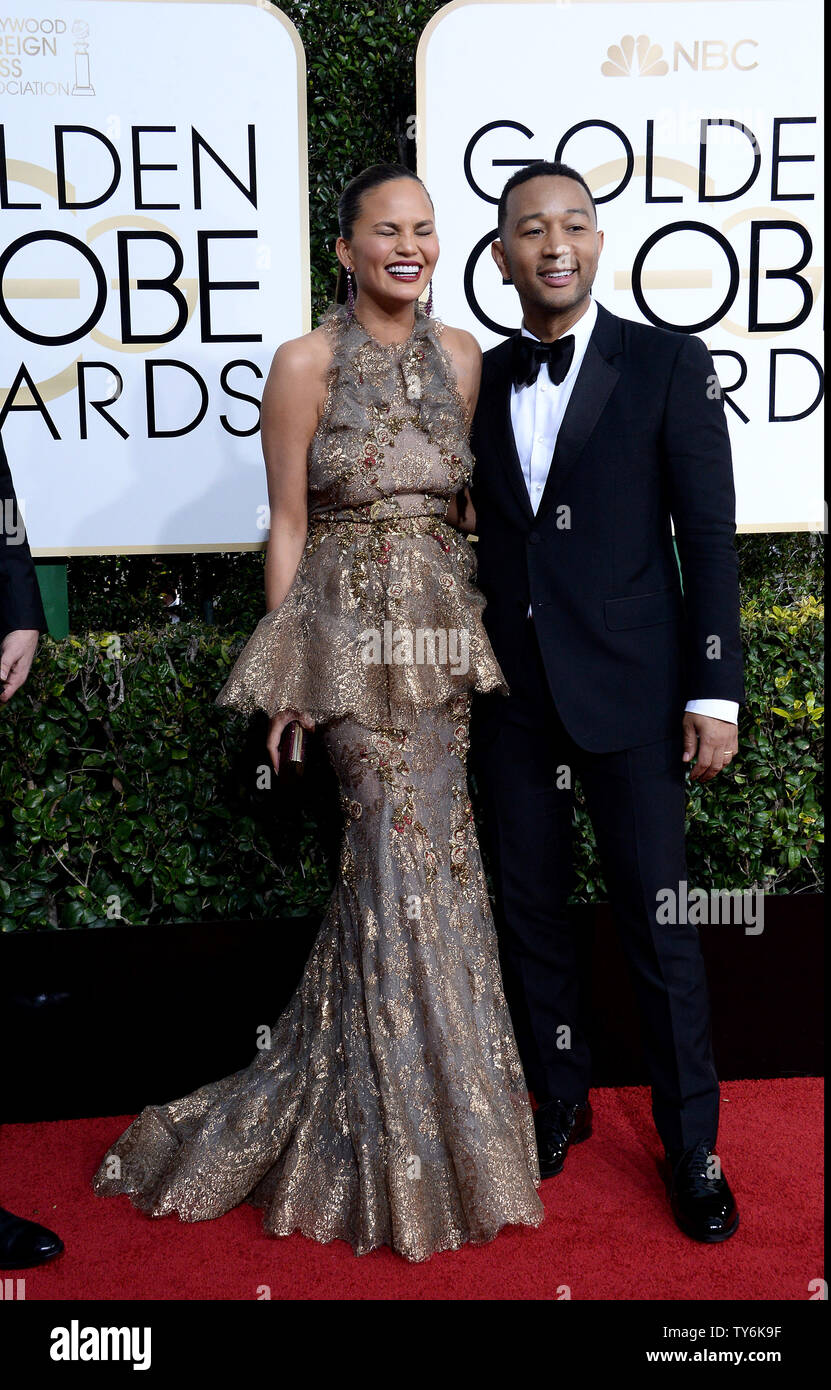 (LR) Chrissy Teigen and John Legend attend the 74th annual Golden