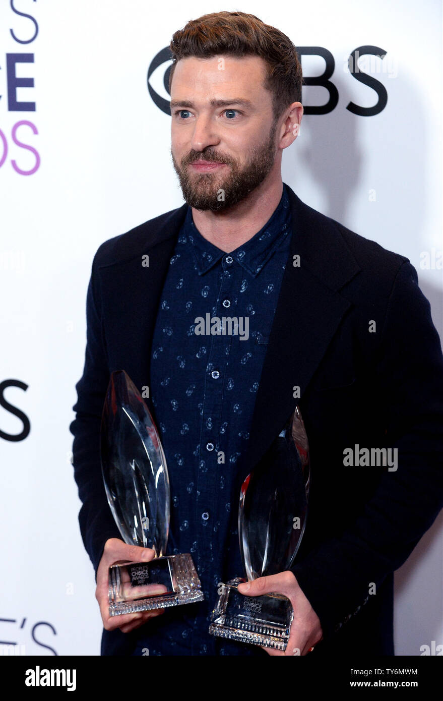 Singer Justin Timberlake appears backstage with his award for Favorite