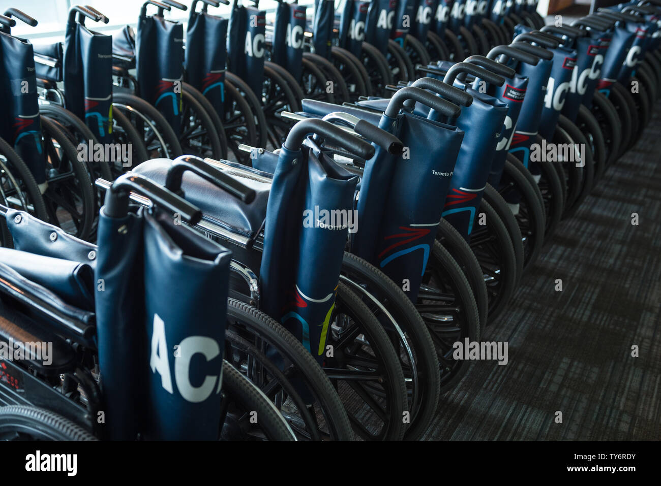Toronto, Ontario / Canada February 2018 A Line Up Of Wheelchairs At The Pearson Airport Lobby