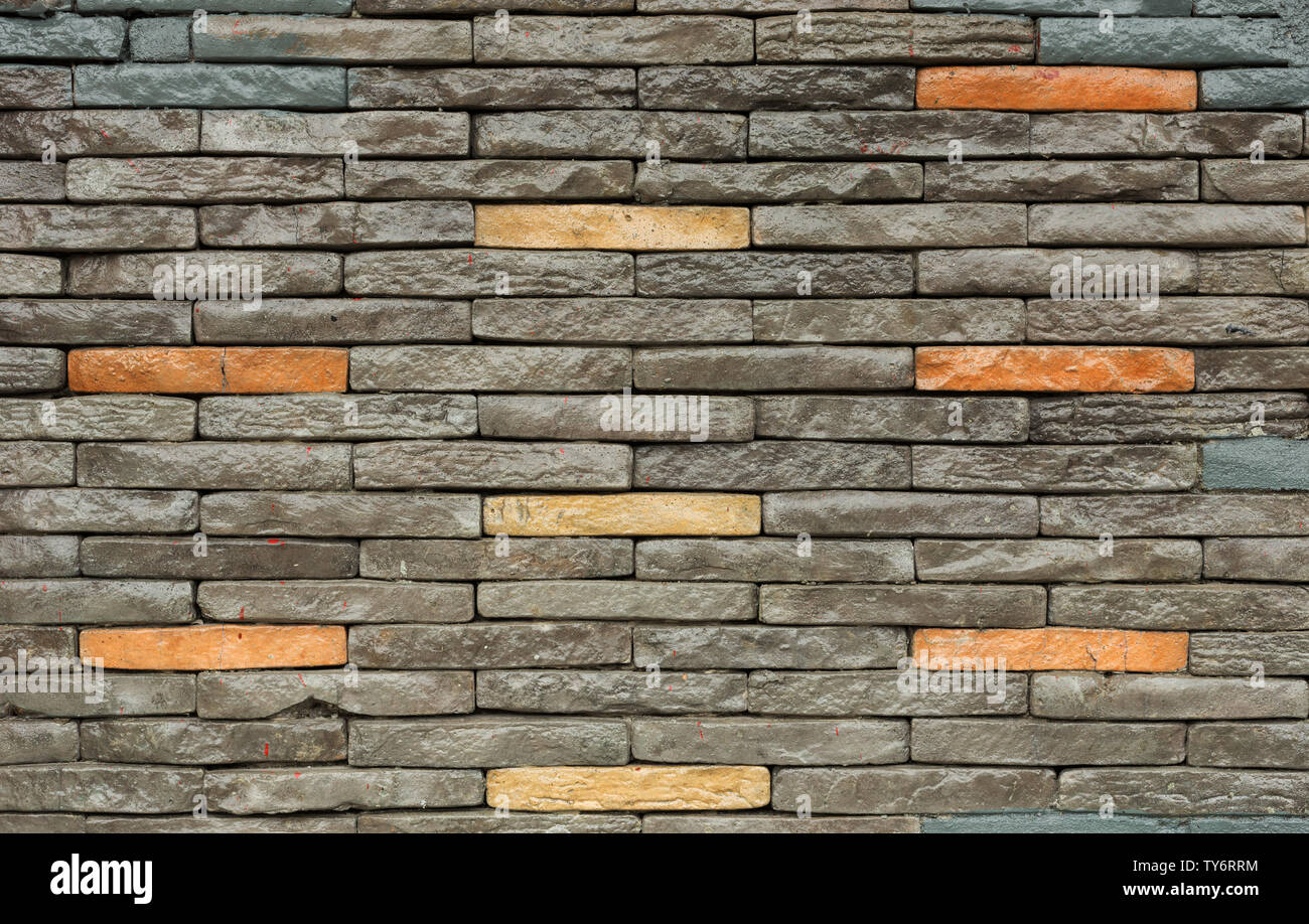 Texture of the brown and grey wall made of stone tile bricks Stock ...